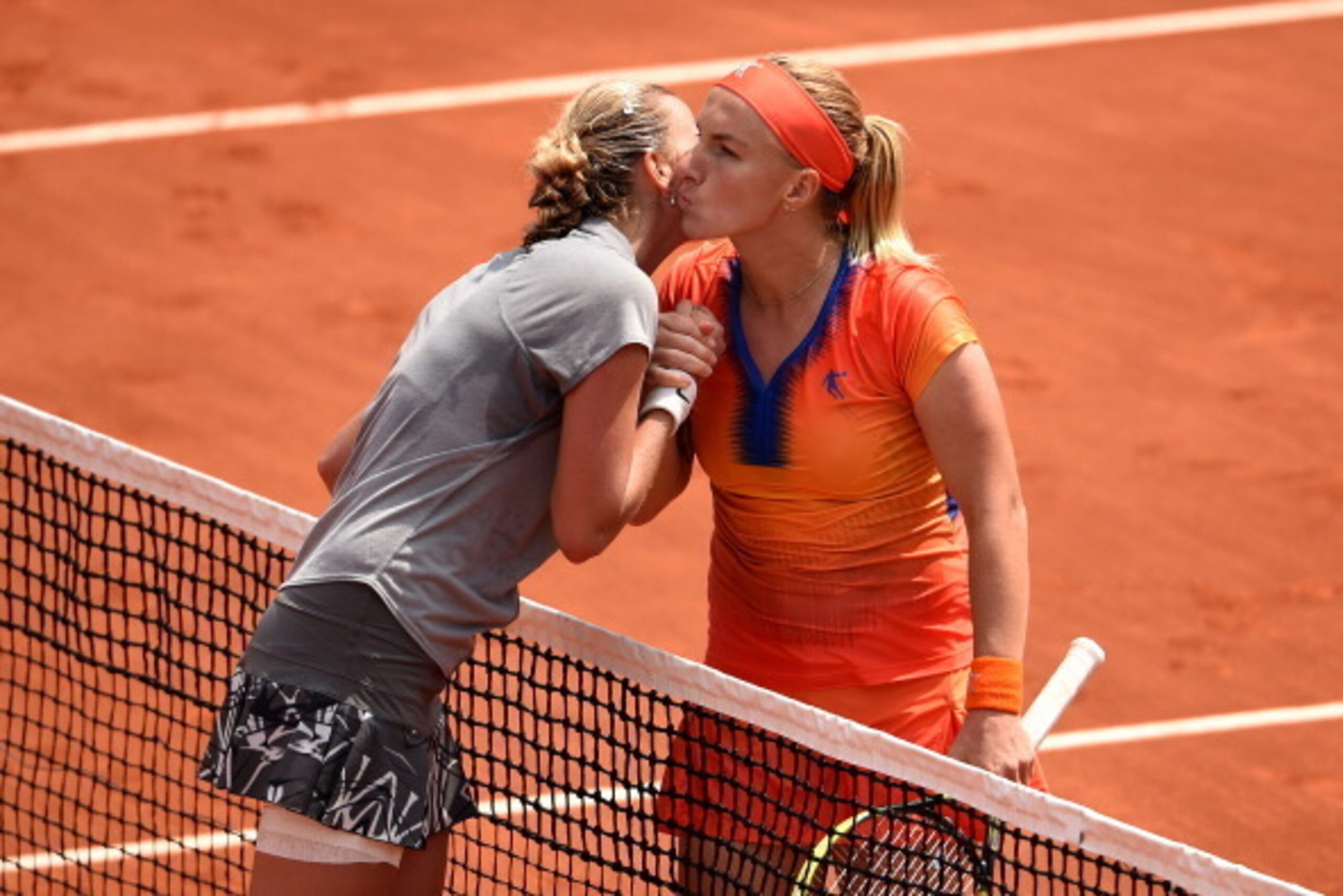 PARIS, FRANCE - MAY 31:  Svetlana Kuznetsova of Russia kisses Petra Kvitova of Czech Republic at the net following her victory in their women's singles match on day seven of the French Open at Roland Garros on May 31, 2014 in Paris, France.  (Photo by Mat