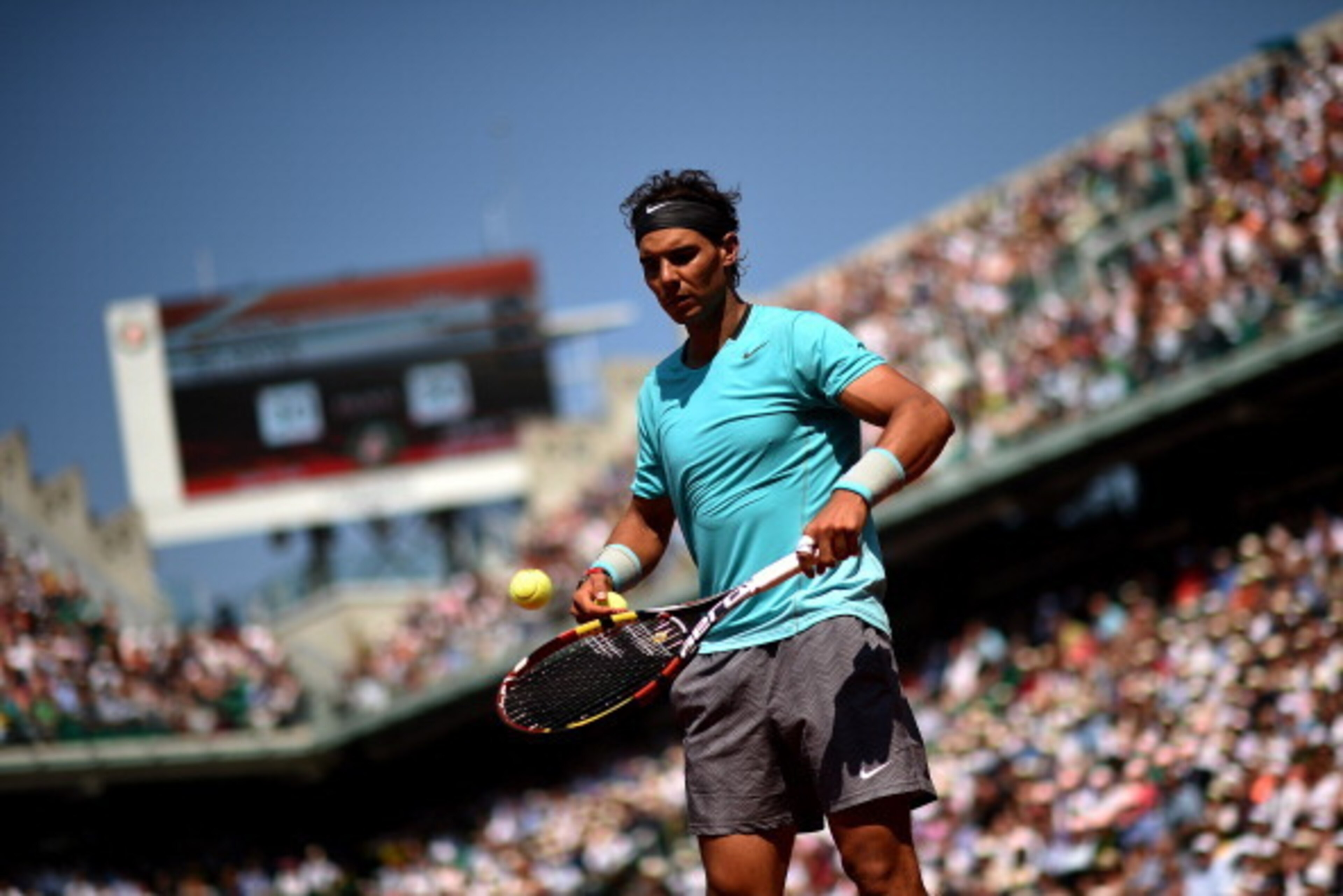 PARIS, FRANCE - MAY 31:  Rafael Nadal of Spain prepares to serve during his men's singles match against Leonardo Mayer of Argentina on day seven of the French Open at Roland Garros on May 31, 2014 in Paris, France.  (Photo by Matthias Hangst/Getty Images)