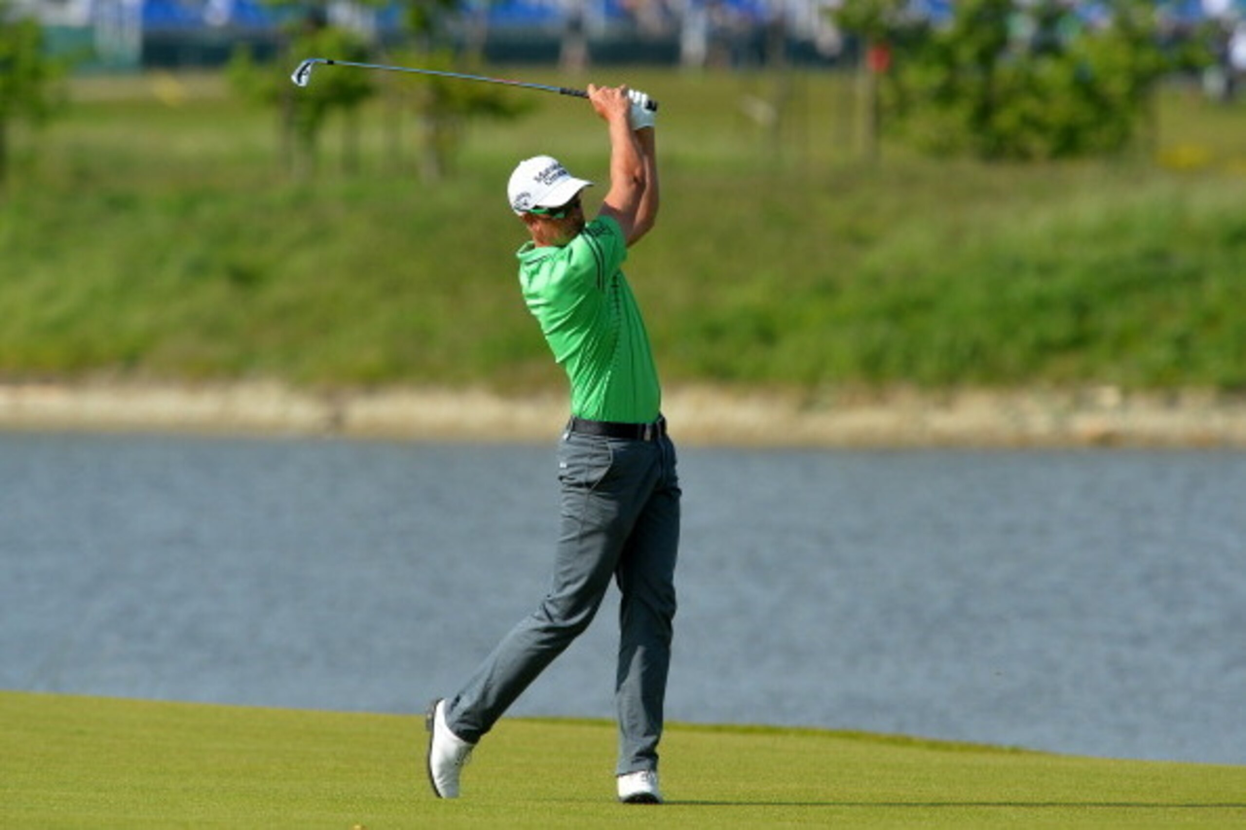 MALMO, SWEDEN - MAY 31:  Henrik Stenson of Sweden plays his approach shot to the 18th green during the Nordea Masters at the PGA Sweden National on May 31, 2014 in Malmo, Sweden. (Photo by Mark Runnacles/Getty Images)