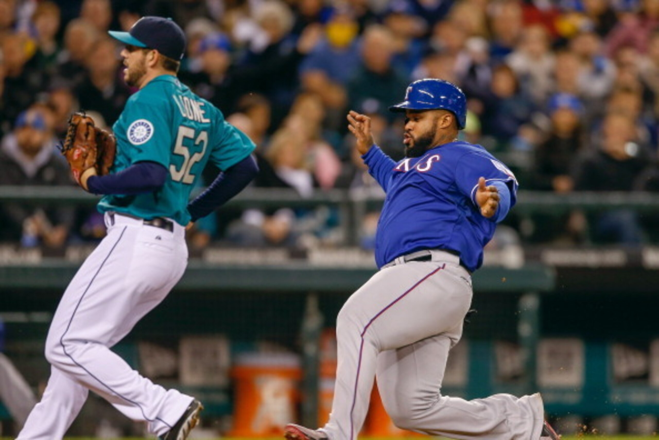 SEATTLE, WA - APRIL 25:  Prince Fielder #84 of the Texas Rangers scores on a wild pitch by relief pitcher Dominic Leone #52 of the Seattle Mariners in the sixth inning at Safeco Field on April 25, 2014 in Seattle, Washington.  (Photo by Otto Greule Jr/Get