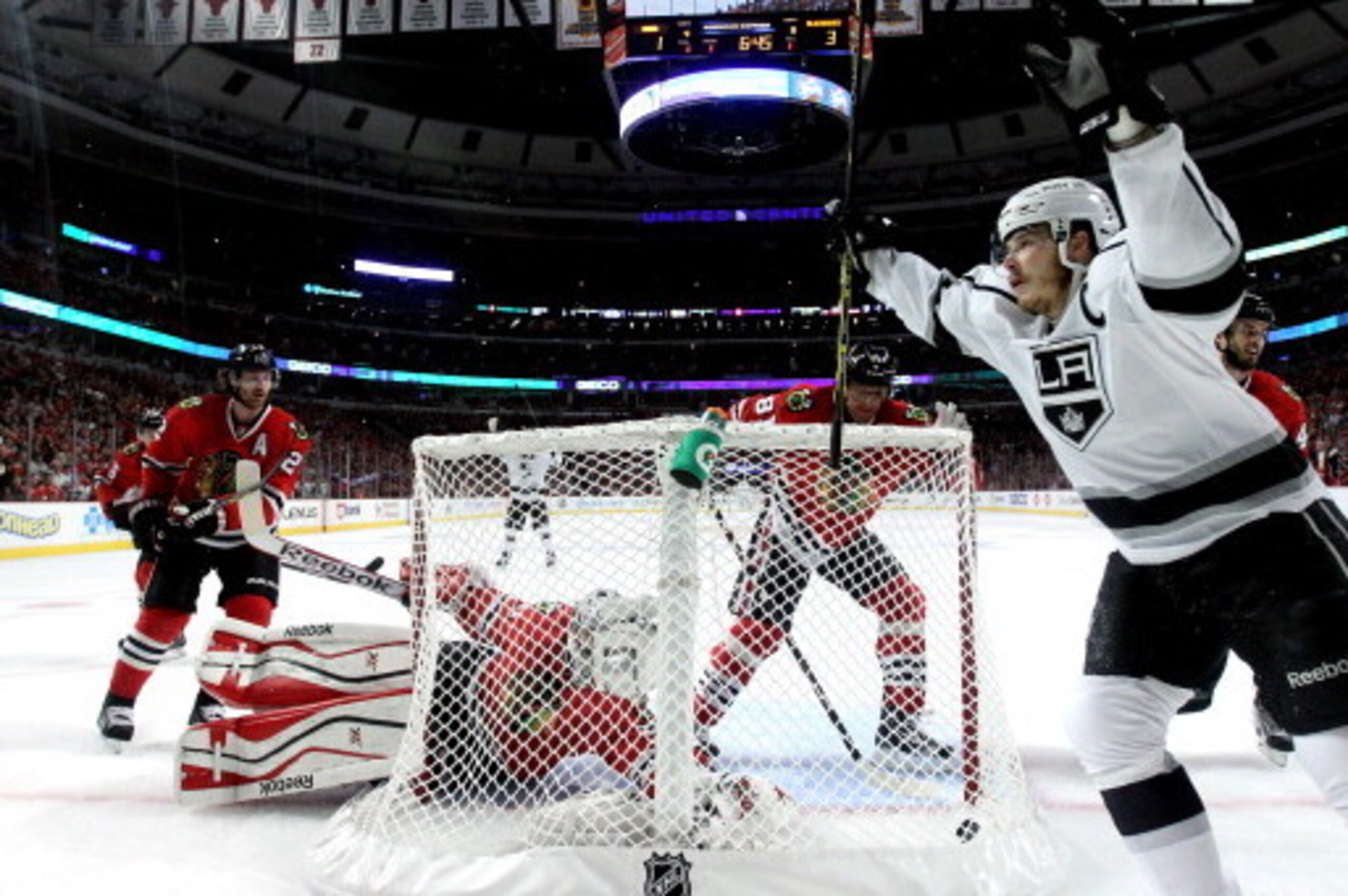 CHICAGO, IL - MAY 28:  Dustin Brown #23 of the Los Angeles Kings celebrates Marian Gaborik #12 goal against Corey Crawford #50 of the Chicago Blackhawks in the first period during Game Five of the Western Conference Final in the 2014 Stanley Cup Playoffs 