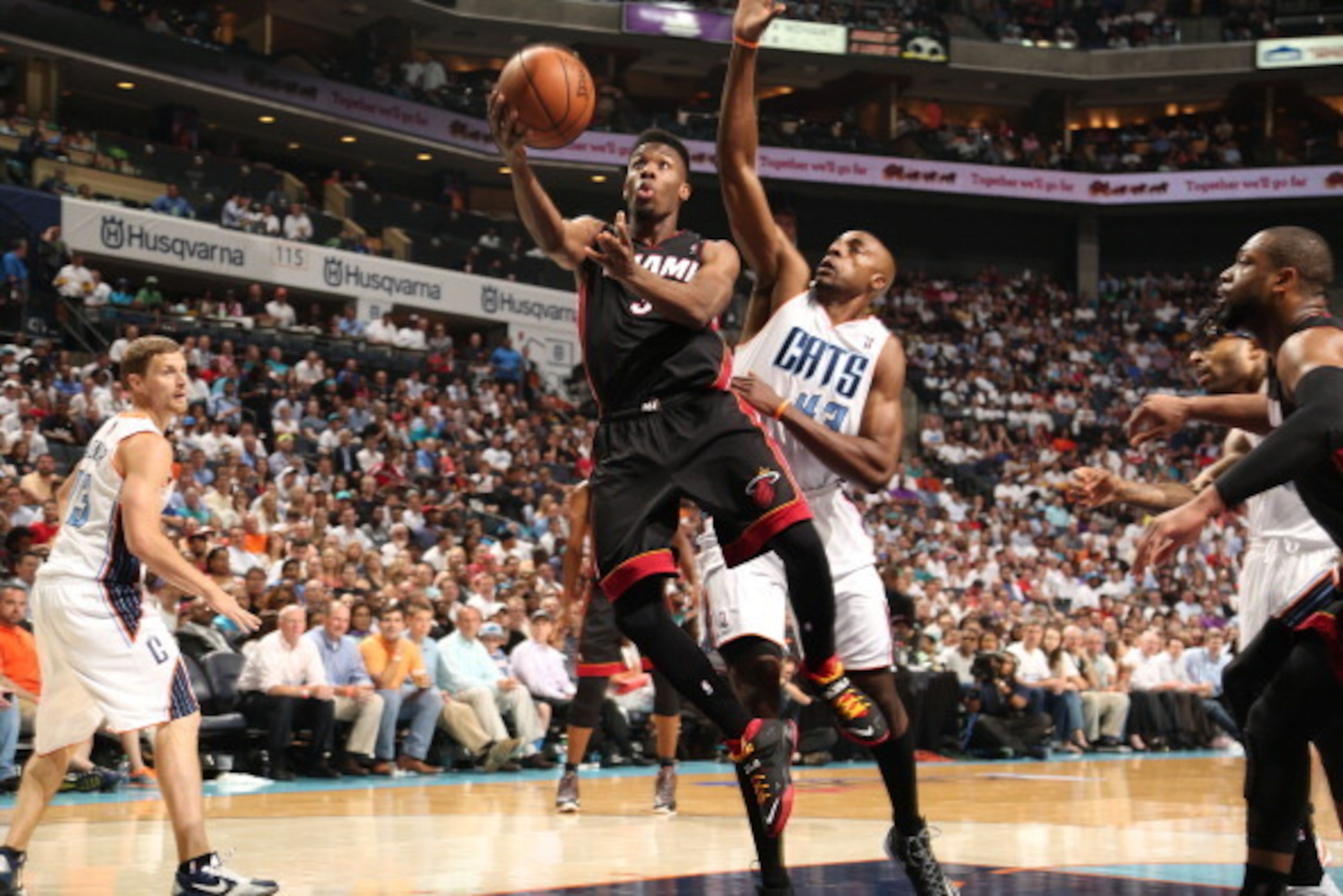 CHARLOTTE, NC - APRIL 28: Norris Cole #30 of the Miami Heat shoots against the Charlotte Bobcats in Game Four of the Eastern Conference Quarterfinals in the 2014 NBA Playoffs at the Time Warner Cable Arena on April 28, 2014 in Charlotte, North Carolina. N