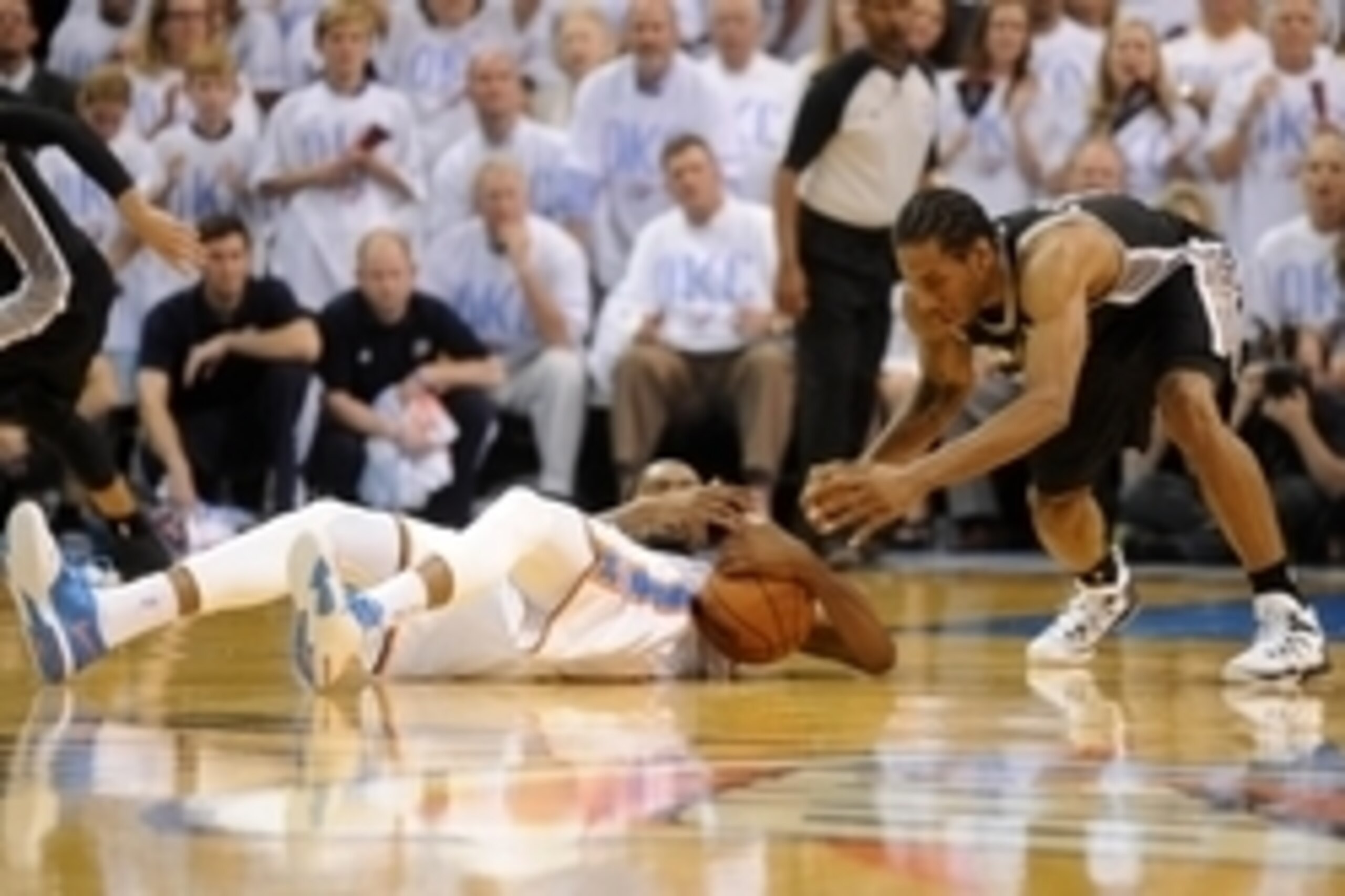 May 31, 2014; Oklahoma City, OK, USA; Oklahoma City Thunder forward Kevin Durant (35) fights for a loose ball with San Antonio Spurs forward Kawhi Leonard (2) during the fourth quarter in game six of the Western Conference Finals of the 2014 NBA Playoffs 