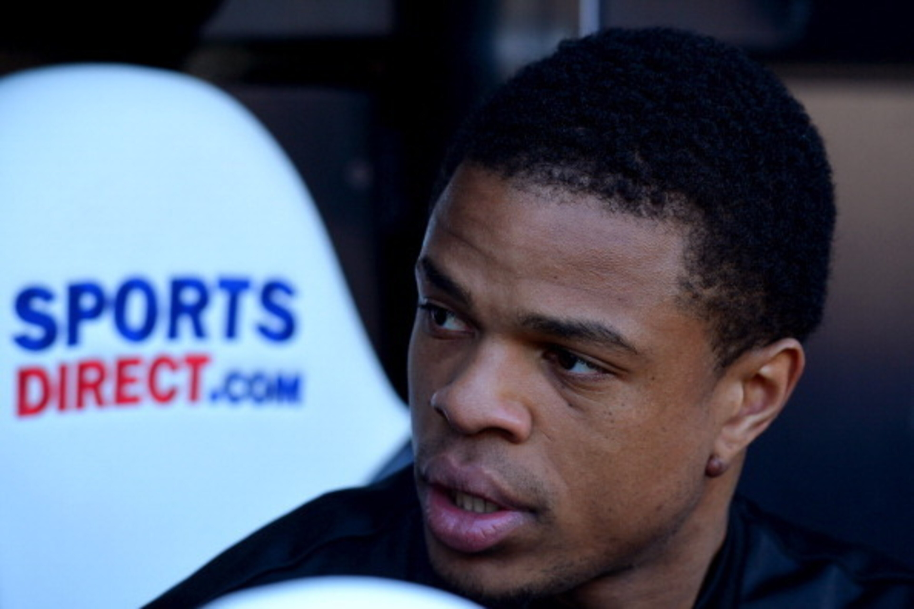 NEWCASTLE UPON TYNE, ENGLAND - APRIL 19:  Loic Remy of Newcastle United looks on from the bench during the Barclays Premier League match between Newcastle United and Swansea City at St James' Park on April 19, 2014 in Newcastle upon Tyne, England.  (Photo