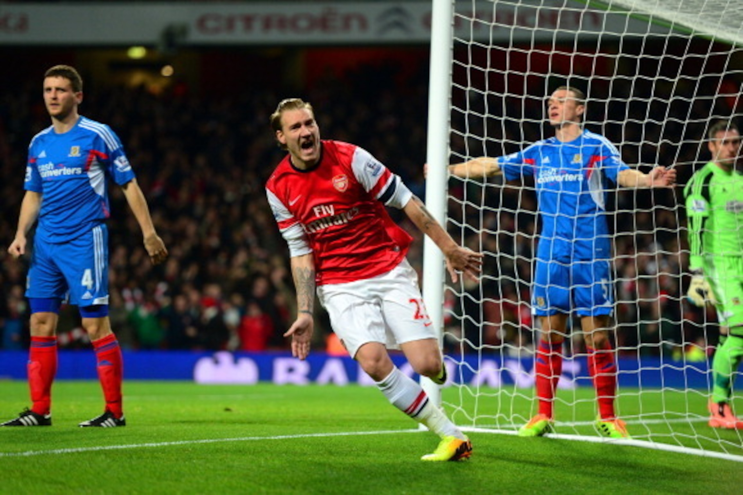 LONDON, ENGLAND - DECEMBER 04: Nicklas Bendtner of Arsenal celebrates scoring the opening goal during the Barclays Premier League match between Arsenal and Hull City at Emirates Stadium on December 4, 2013 in London, England.  (Photo by Jamie McDonald/Get
