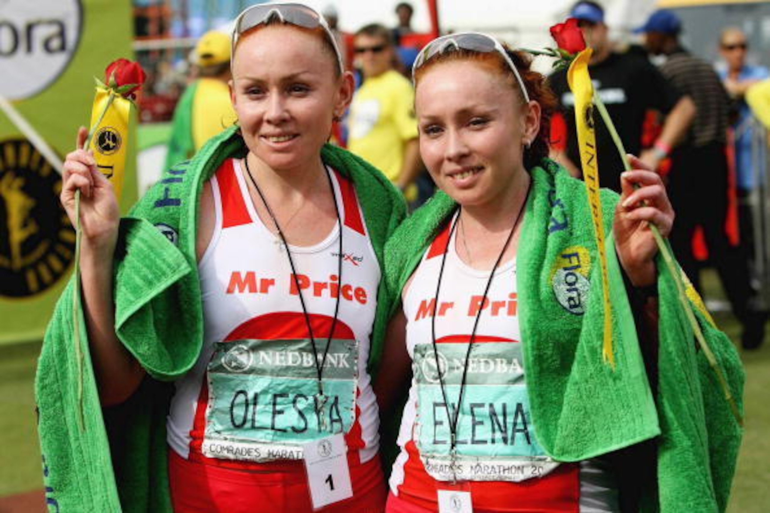 DURBAN, SOUTH AFRICA - 24 MAY: Olesya Nurgalieva (L) of Russia celebrates with sister Elena Nurgalieva of Russia after their respective first and second places in the Comrades Marathon women's race between Durban and Pietermaritzburg on May 24, 2009 in D DURBAN, SOUTH AFRICA - 24 MAY: Olesya Nurgalieva (L) of Russia celebrates with sister Elena Nurgalieva of Russia after their respective first and second places in the Comrades Marathon women's race between Durban and Pietermaritzburg on May 24, 2009 in D