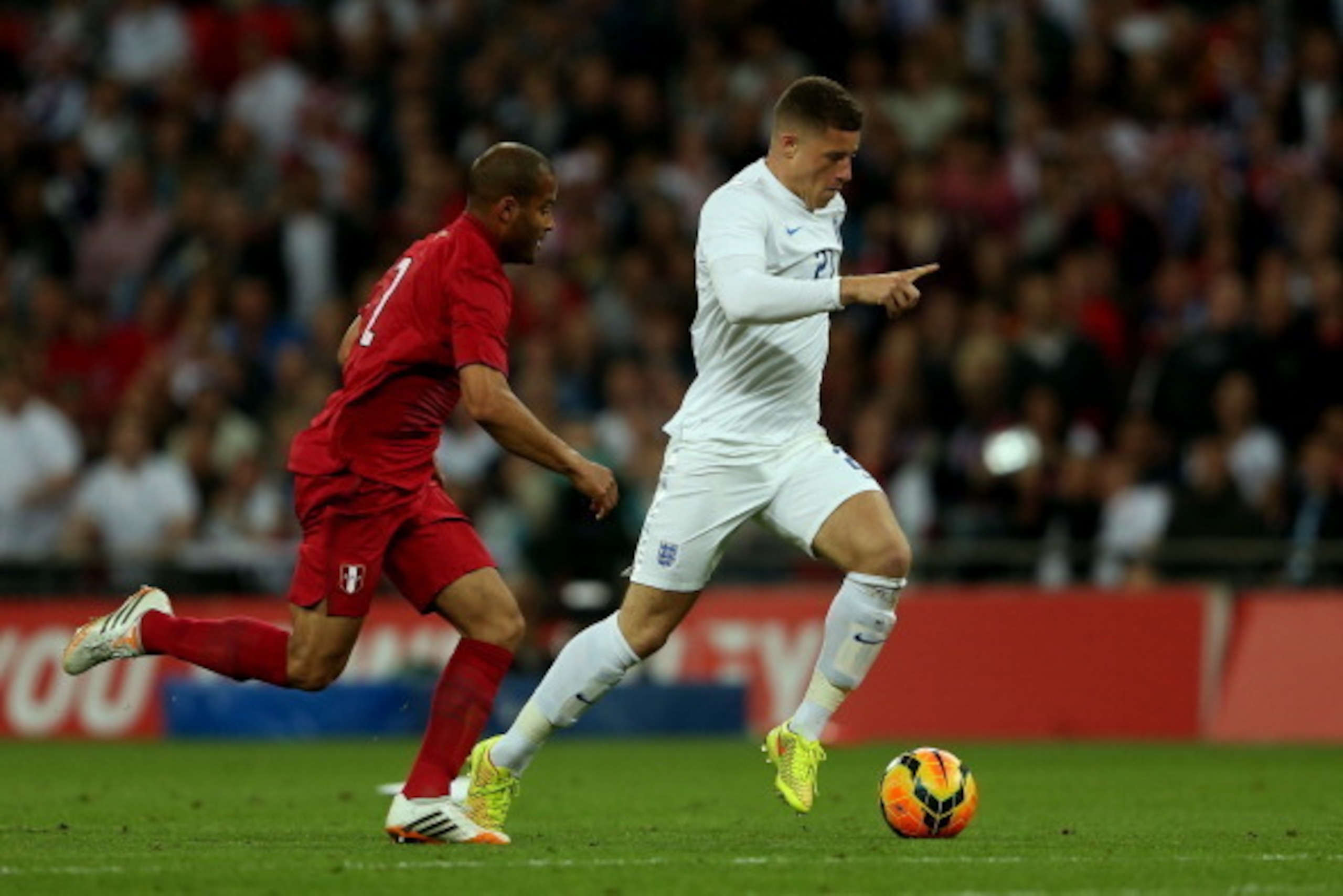 LONDON, ENGLAND - MAY 30: Alberto Rodriguez of Peru closes down Ross Barkley of England during the international friendly match between England and Peru at Wembley Stadium on May 30, 2014 in London, England.  (Photo by Warren Little/Getty Images)