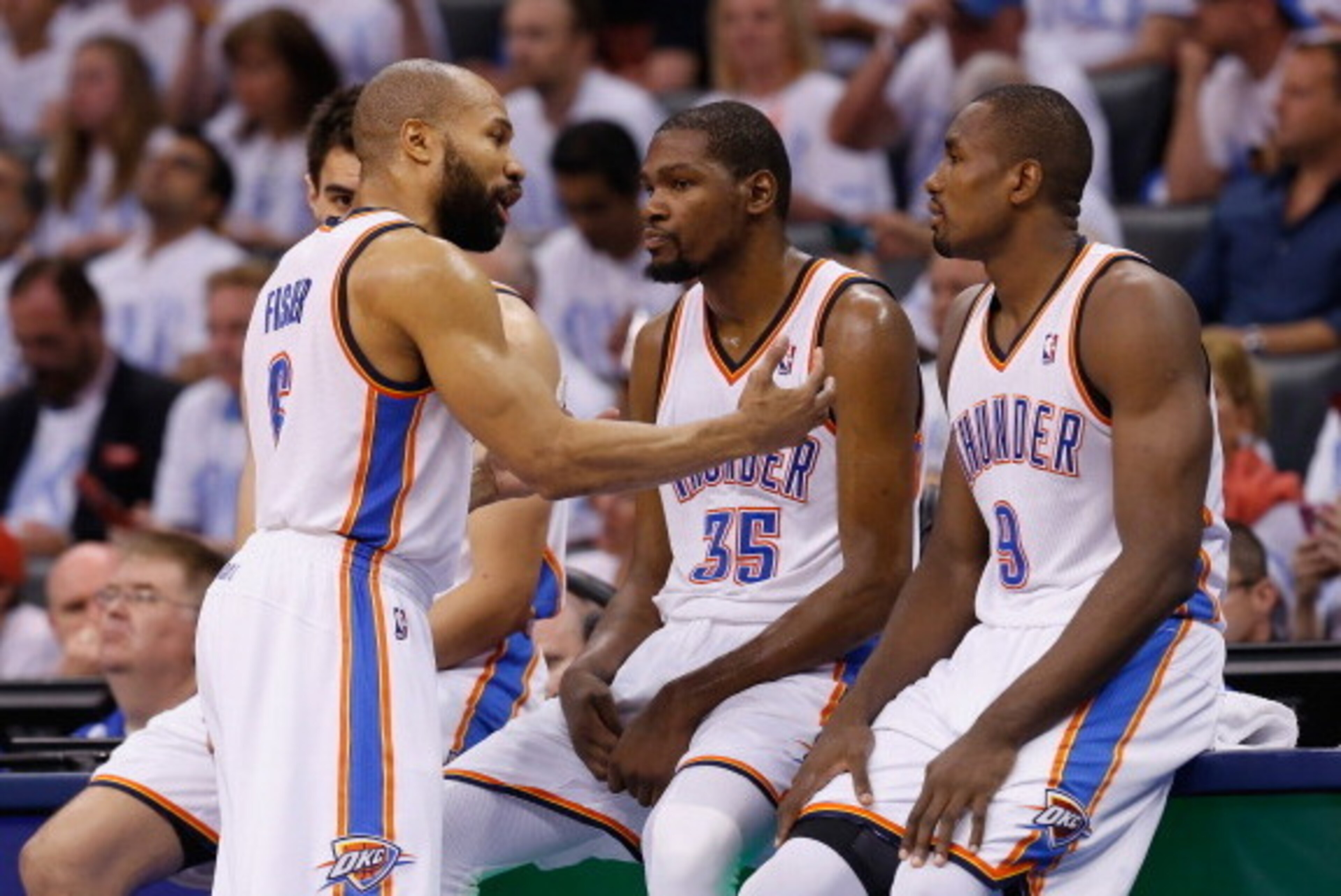 OKLAHOMA CITY, OK - MAY 31:  Derek Fisher #6, Kevin Durant #35 and Serge Ibaka #9 of the Oklahoma City Thunder wait to enter the game against the San Antonio Spurs in the second half during Game Six of the Western Conference Finals of the 2014 NBA Playoff