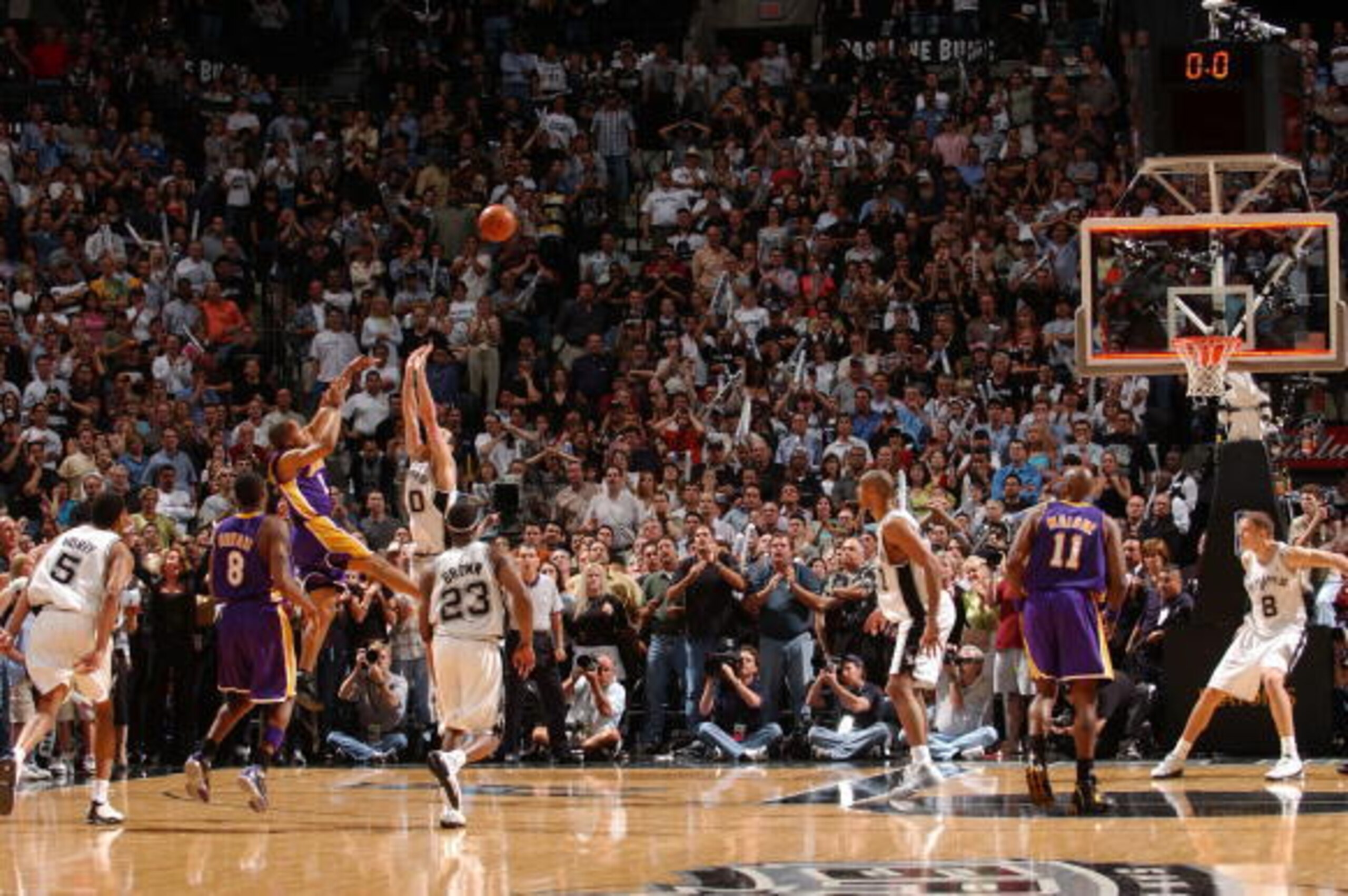 SAN ANTONIO - MAY 13:  Derek Fisher # 2 of the Los Angeles Lakers shoots and makes the game-winning shot over Emanuel Ginobili #20 of the San Antonio Spurs at the buzzer in Game five of the Western Conference Semifinals during the 2004 NBA Playoffs May 13