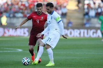 LISBON, PORTUGAL - MAY 31:  Katsouranis of Greece with Miguel Veloso of Portugal during the International Friendly between Portugal and Greece at the National Stadium on May 31, 2014 in Lisbon, Portugal. (Photo by Gualter Fatia/Getty Images)