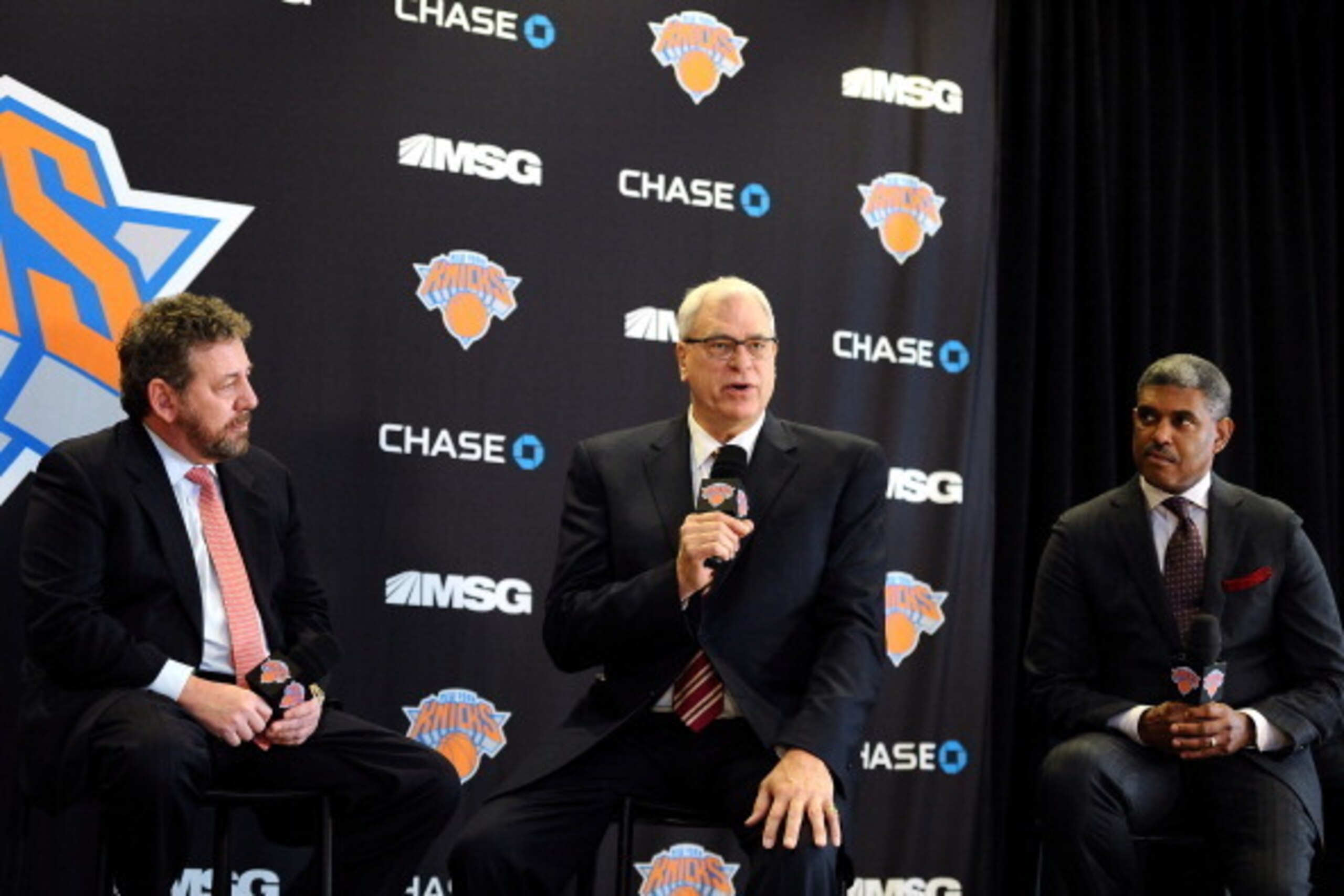 NEW YORK, NY - MARCH 18:  (L to R) James Dolan, Executive Chairman of Madison Square Garden, Phil Jackson, and Steve Mills, General Manager of the New York Knicks, answer questions during the press conference to announce Jackson as President of the New Yo