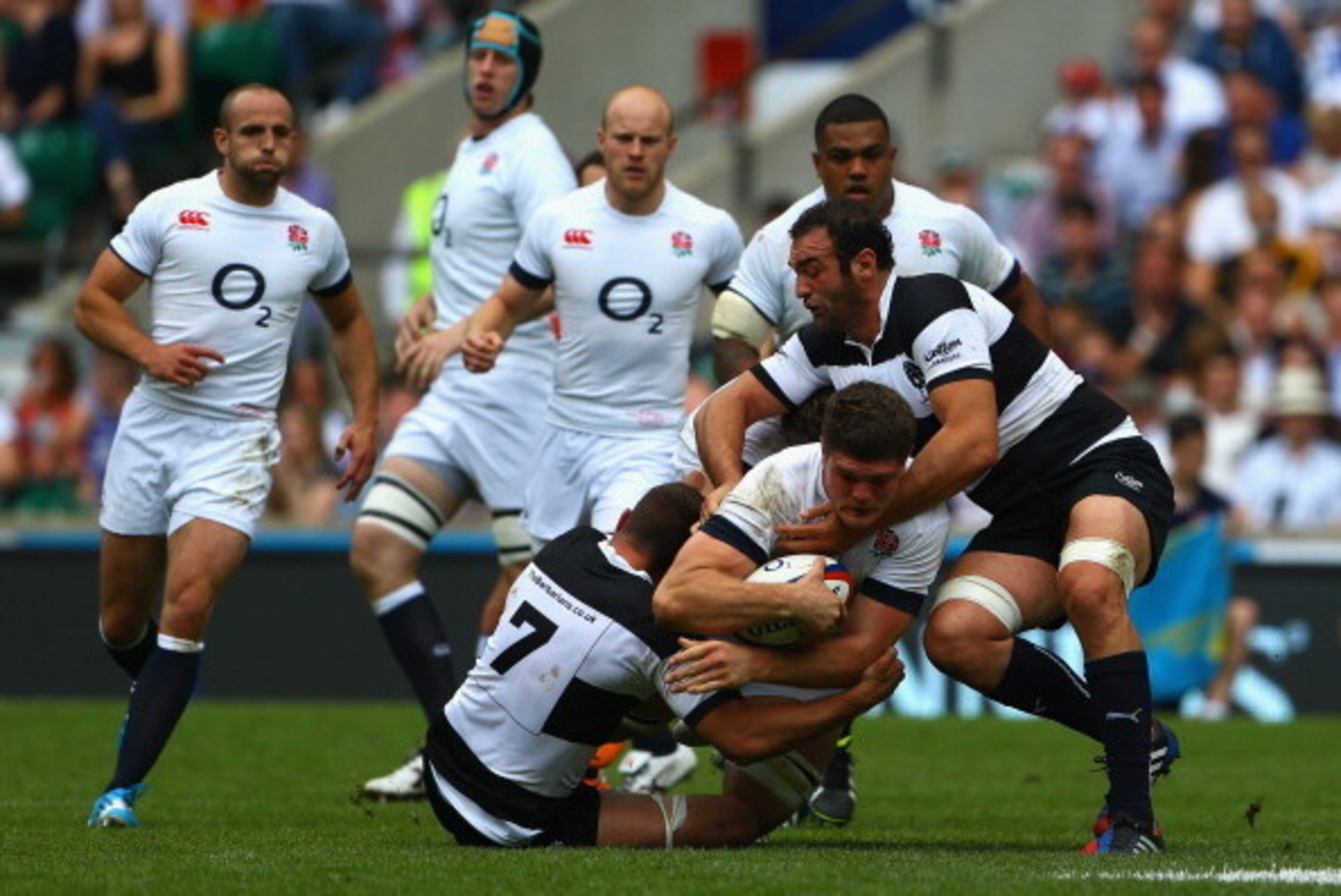 LONDON, ENGLAND - JUNE 01:  Dave Ewers of England is tackled by Alexandre Lapandry of the Barbarians (L) during the Rugby Union International Match between England and The Barbarians at Twickenham Stadium on June 1, 2014 in London, England  (Photo by Matt