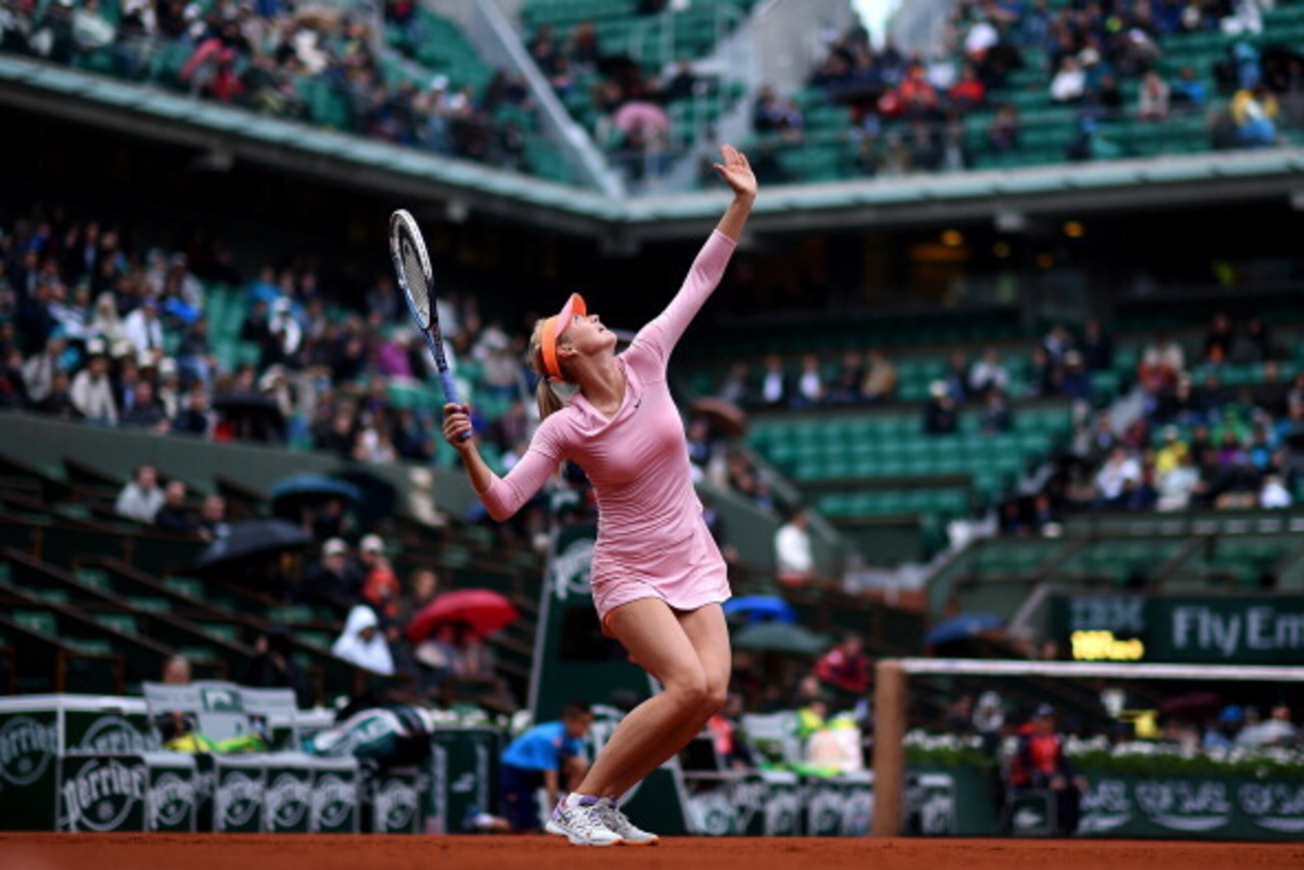 PARIS, FRANCE - MAY 28:  Maria Sharapova of Russia serves during her women's singles match against Tsvetana Pironkova of Bulgaria on day four of the French Open at Roland Garros on May 28, 2014 in Paris, France.  (Photo by Matthias Hangst/Getty Images)