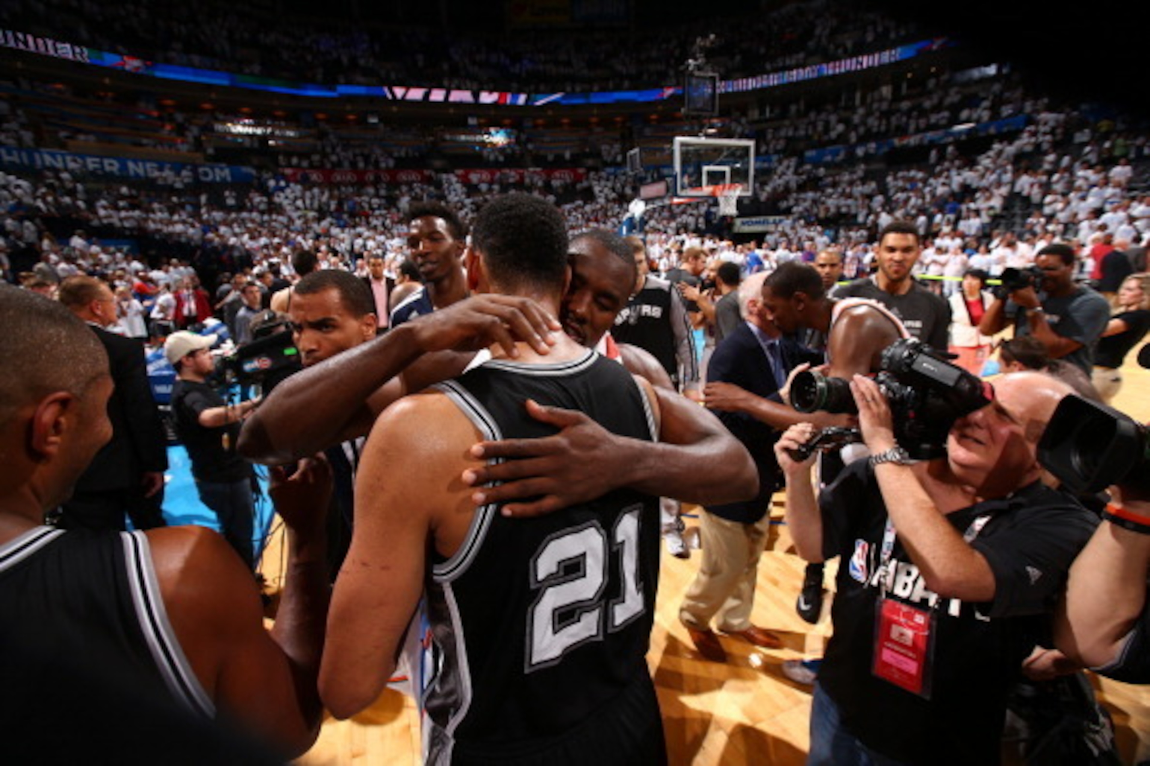 OKLAHOMA CITY, OK - MAY 31: Tim Duncan #21 of the San Antonio Spurs and Serge Ibaka #9 of the Oklahoma City Thunder after Game 6 of the Western Conference Finals during the 2014 NBA playoffs at Chesapeake Energy Arena on may 31, 2014 in Oklahoma City, Okl