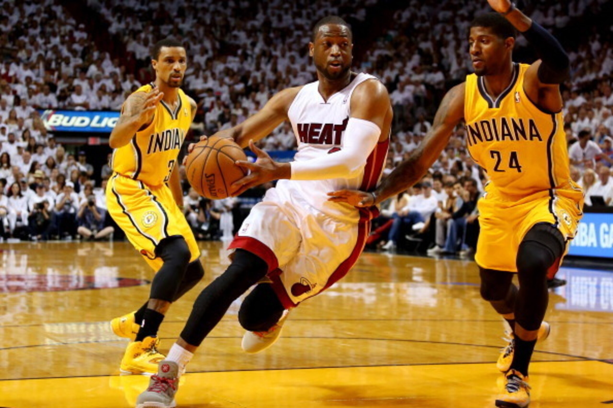MIAMI, FL - MAY 30:  Dwyane Wade #3 of the Miami Heat drives to the basket as Paul George #24 of the Indiana Pacers defends during Game Six of the Eastern Conference Finals of the 2014 NBA Playoffs at American Airlines Arena on May 30, 2014 in Miami, Flor