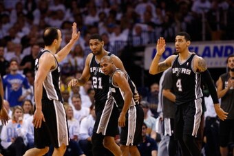 OKLAHOMA CITY, OK - MAY 31:  Manu Ginobili #20 and Danny Green #4  of the San Antonio Spurs celebrate with their teammates after a play against the Oklahoma City Thunder in the second half during Game Six of the Western Conference Finals of the 2014 NBA P