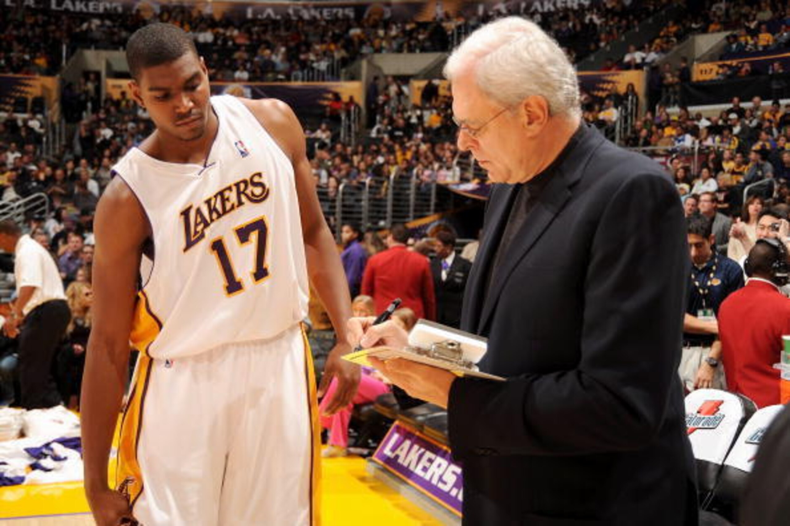 LOS ANGELES - DECEMBER 07:  Head Coach Phil Jackson of the Los Angeles Lakers draws up a play for his player Andrew Bynum #17 during the game against the Milwaukee Bucks on December 7, 2008 at Staples Center in Los Angeles, California.  The Lakers won 105