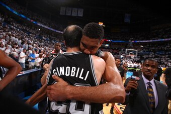OKLAHOMA CITY, OK - MAY 31: Tim Duncan #21 of the San Antonio Spurs and Manu Ginobili #20 of the San Antonio Spurs after Game 6 of the Western Conference Finals during the 2014 NBA playoffs at Chesapeake Energy Arena on may 31, 2014 in Oklahoma City, Okla