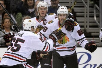 LOS ANGELES, CA - MAY 30:  Patrick Kane #88 of the Chicago Blackhawks celebrates with teammates Andrew Shaw #65 and Jonathan Toews #19 of the Chicago Blackhawks after Kane scores a second period goal against the Los Angeles Kings in Game Six of the Wester