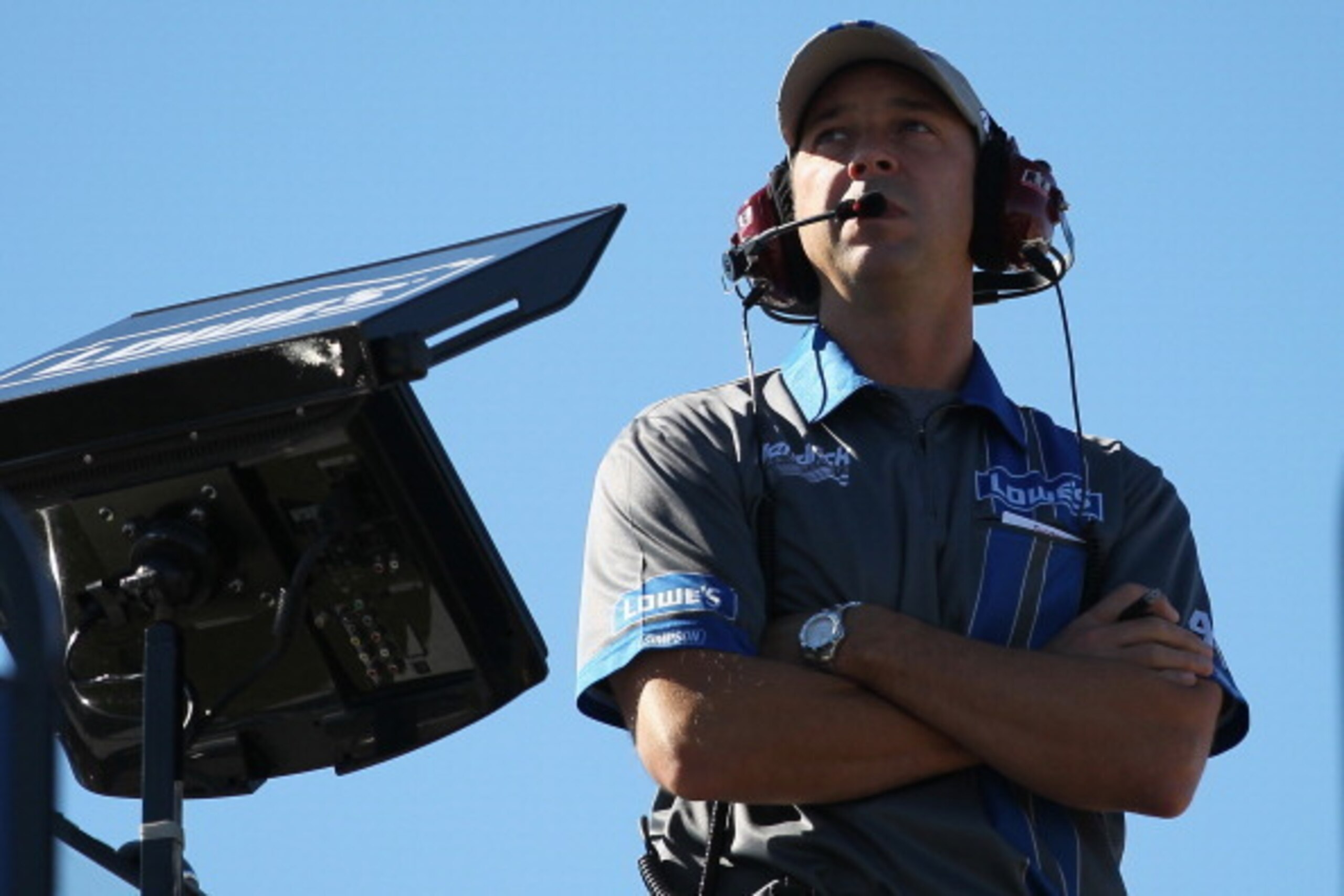 JOLIET, IL - SEPTEMBER 14: Chad Knaus, crew chief for the #48 Lowe's Chevrolet, watches from atop the team hauler during practice for the NASCAR Sprint Cup Series Geico 400 at Chicagoland Speedway on September 14, 2013 in Joliet, Illinois.  (Photo by Geof