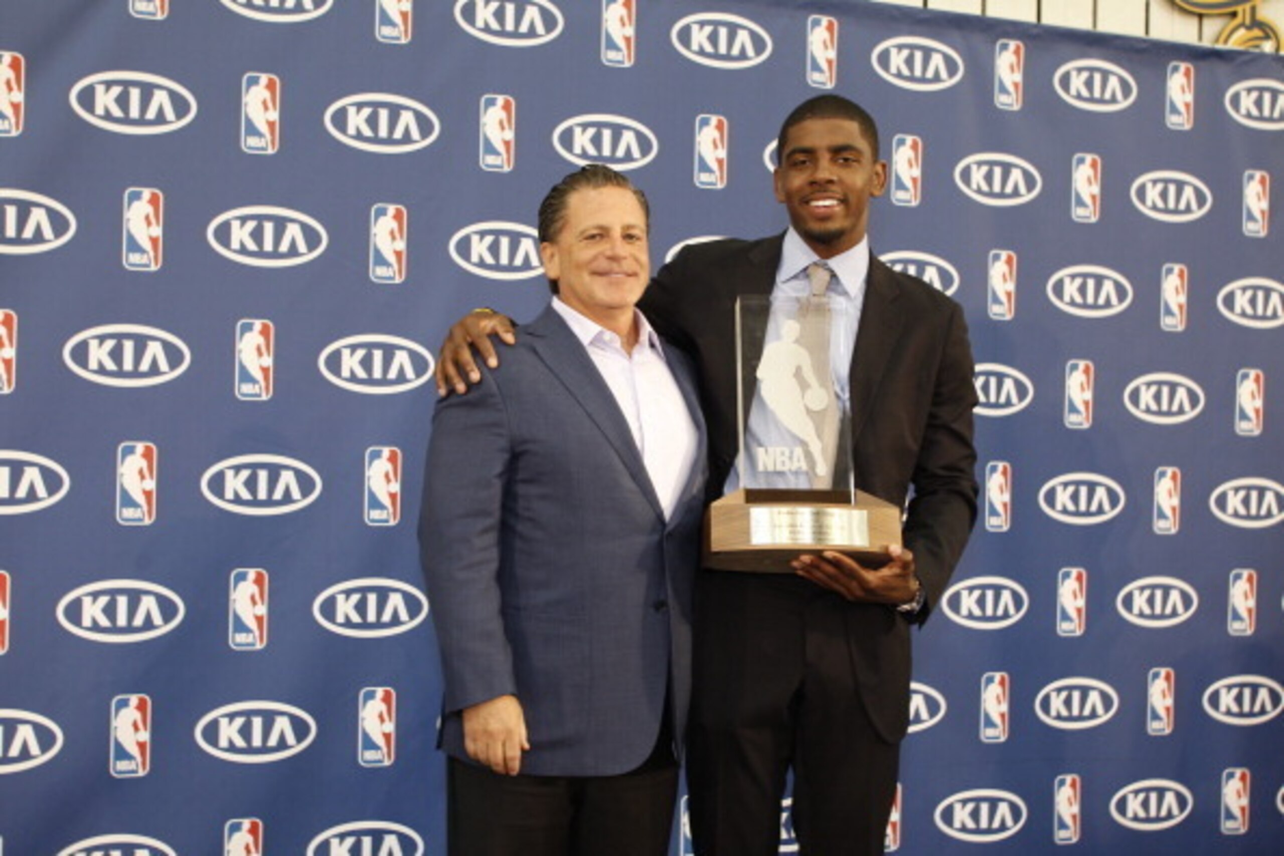 INDEPENDENCE, OH - MAY 15: Owner Dan Gilbert and Kyrie Irving #2 of the Cleveland Cavaliers poses for a portrait as Kyrie is the recipient of the Eddie Gottlieb Trophy as the 2011-12 Kia NBA Rookie of the Year on May 15, 2012 at Cleveland Clinic Courts in INDEPENDENCE, OH - MAY 15: Owner Dan Gilbert and Kyrie Irving #2 of the Cleveland Cavaliers poses for a portrait as Kyrie is the recipient of the Eddie Gottlieb Trophy as the 2011-12 Kia NBA Rookie of the Year on May 15, 2012 at Cleveland Clinic Courts in