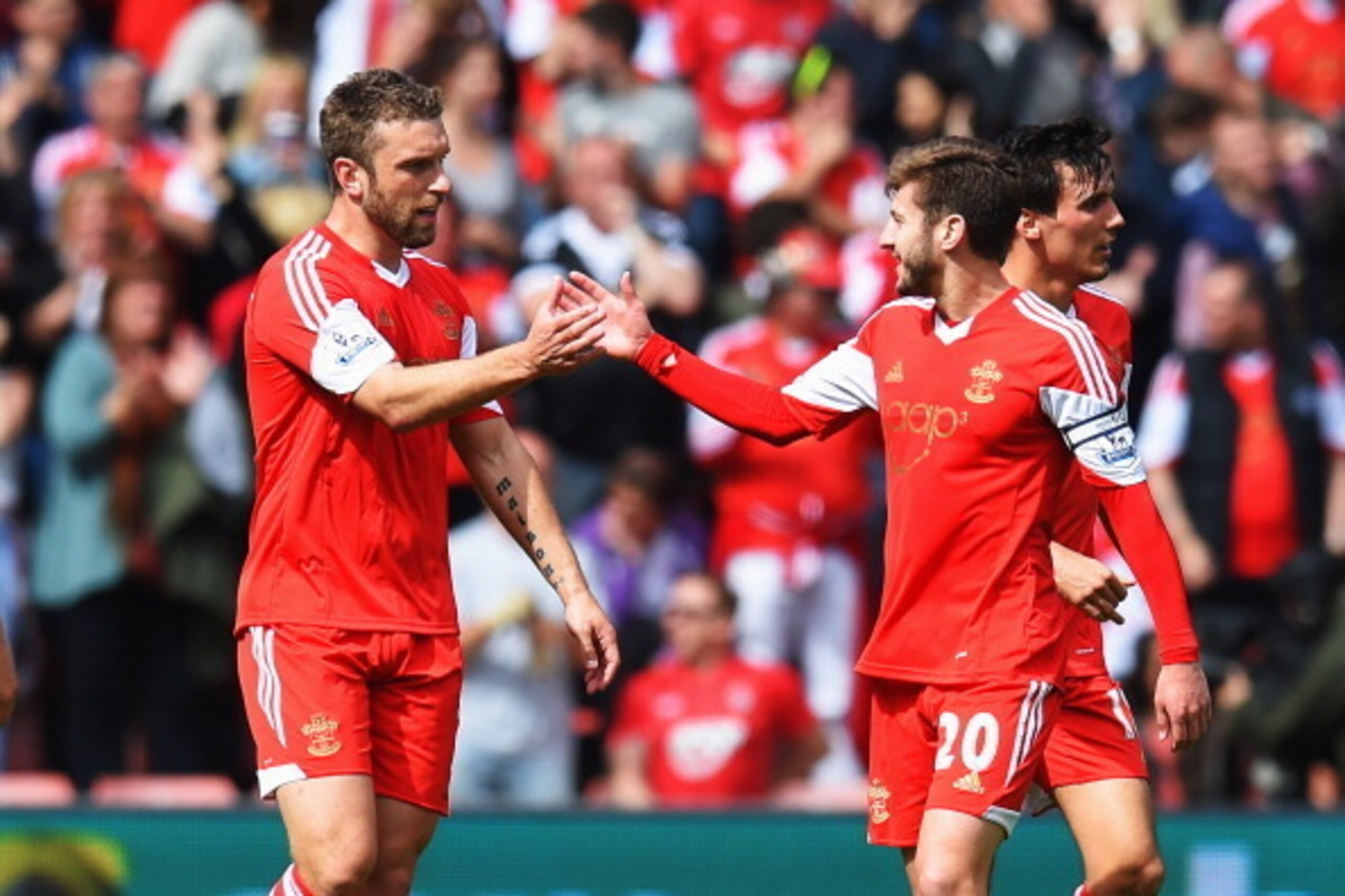 SOUTHAMPTON, ENGLAND - MAY 11:  Rickie Lambert (L) of Southampton celebrates with team mate Adam Lallana (R) after scoring during the Barclays Premier League match between Southampton and Manchester United at St Mary's Stadium on May 11, 2014 in Southampt