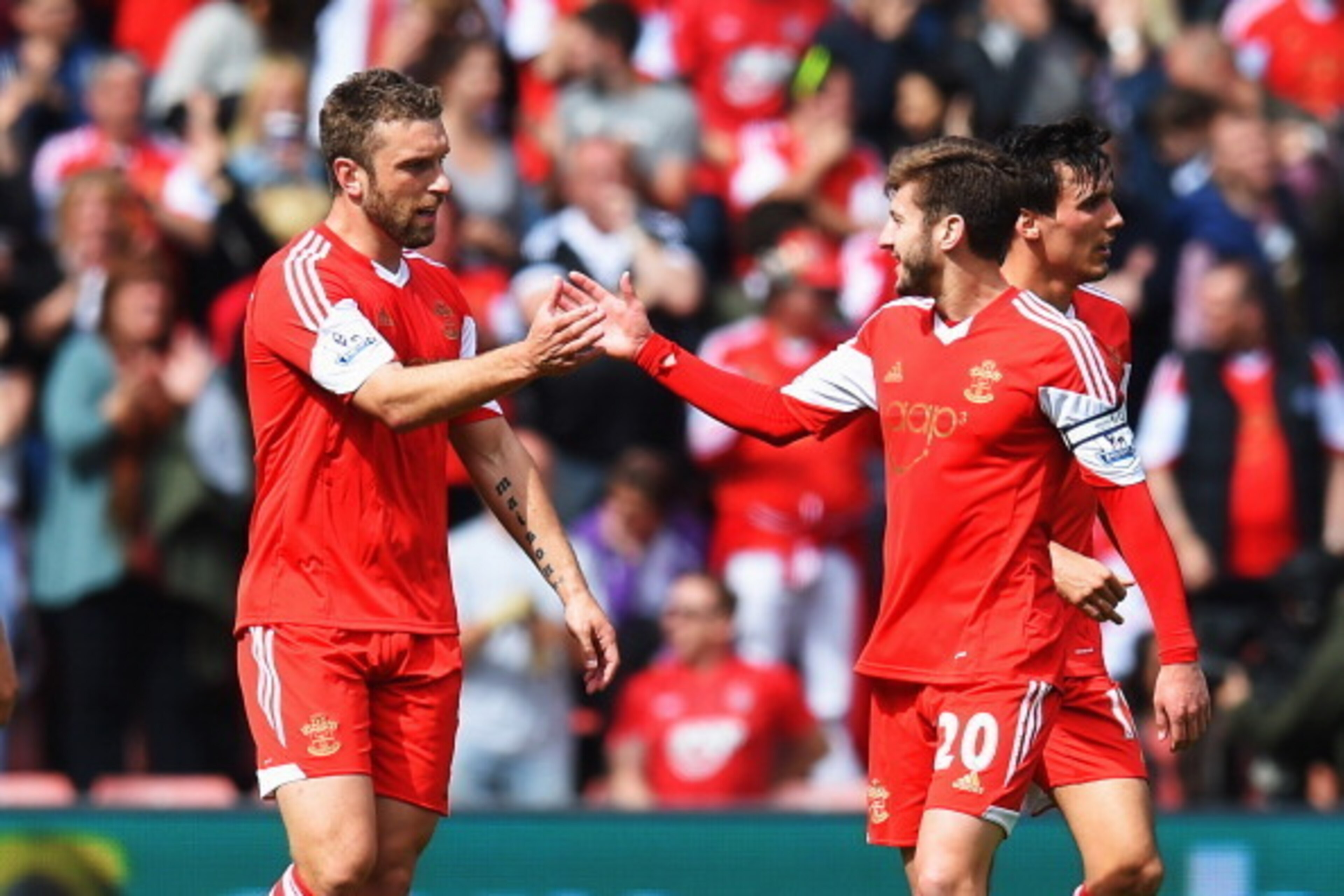 SOUTHAMPTON, ENGLAND - MAY 11:  Rickie Lambert (L) of Southampton celebrates with team mate Adam Lallana (R) after scoring during the Barclays Premier League match between Southampton and Manchester United at St Mary's Stadium on May 11, 2014 in Southampt