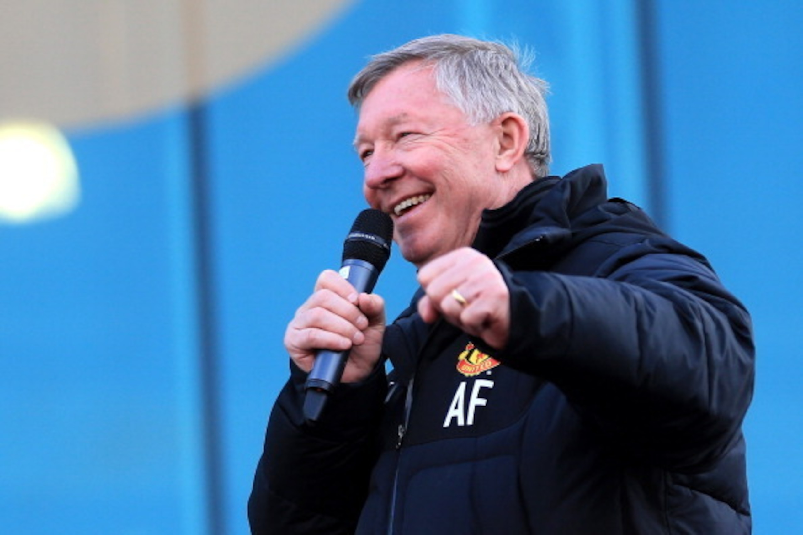 MANCHESTER, ENGLAND - MAY 13:  Sir Alex Ferguson addresses the crown from an open-top bus at the start of their Barclays Premier League Trophy Parade through Manchester on May 13, 2013 in Manchester, England.  (Photo by Christopher Furlong/Getty Images)