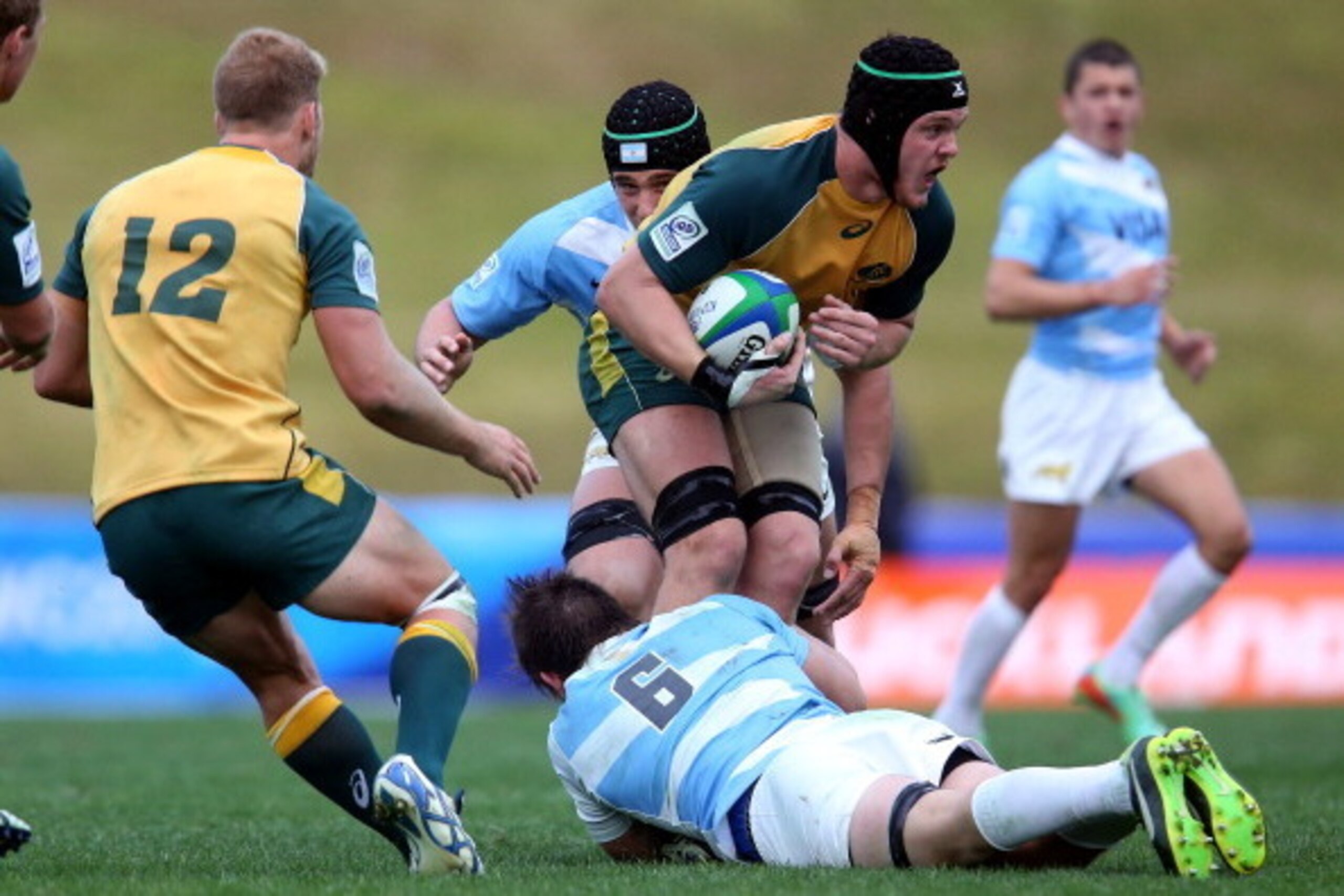 AUCKLAND, NEW ZEALAND - JUNE 02: Ross Haylett-Petty of Australia is tackled by Tomas Lezana of Argentina during the 2014 Junior World Championships match between Argentina and Australia at ECOLight Stadium, Pukekohe on June 2, 2014 in Auckland, New Zealan