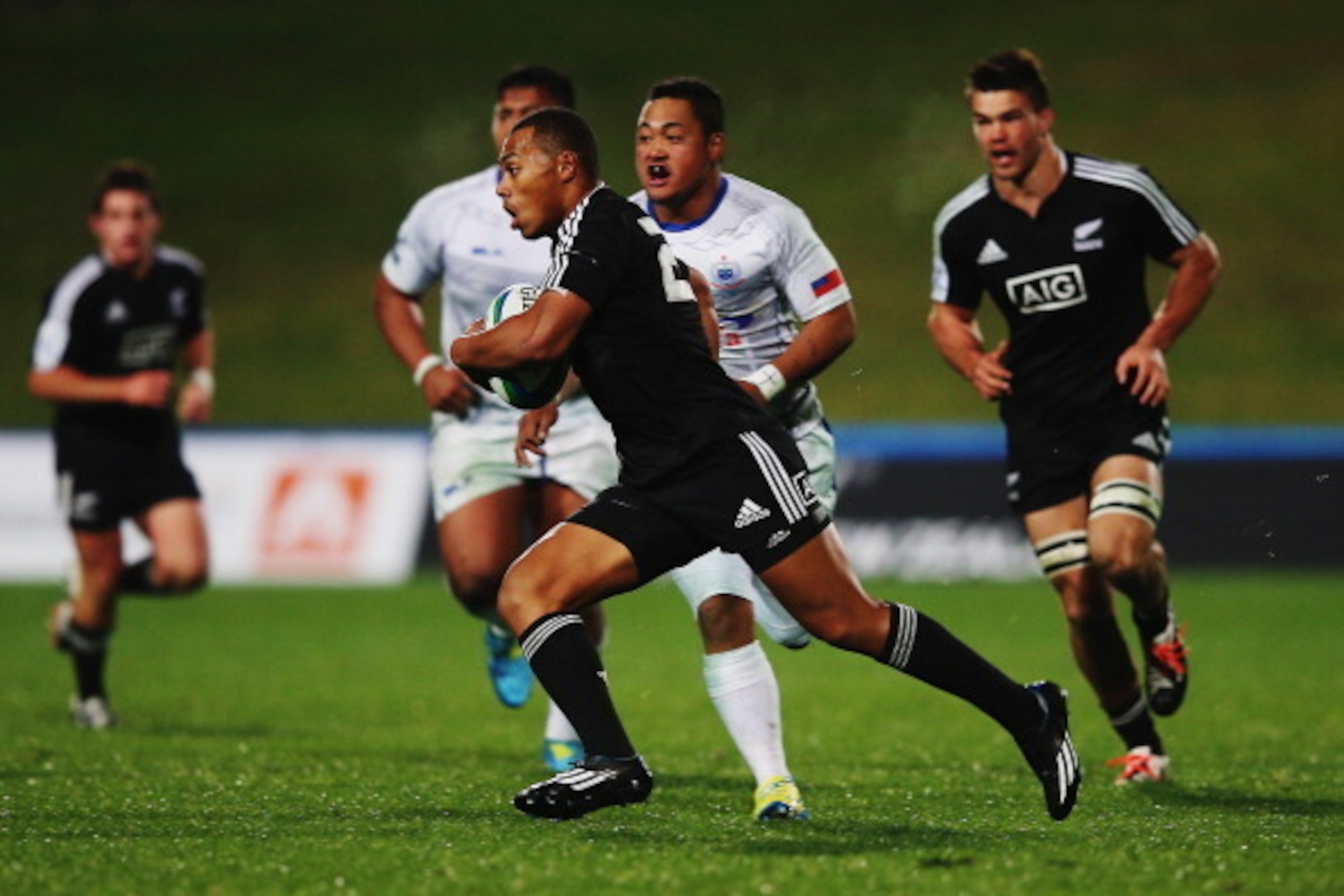 AUCKLAND, NEW ZEALAND - JUNE 02:  Tevita Li of New Zealand makes a break during the 2014 Junior World Championships match between New Zealand and Samoa at QBE Stadium on June 2, 2014 in Auckland, New Zealand.  (Photo by Hannah Peters/Getty Images)
