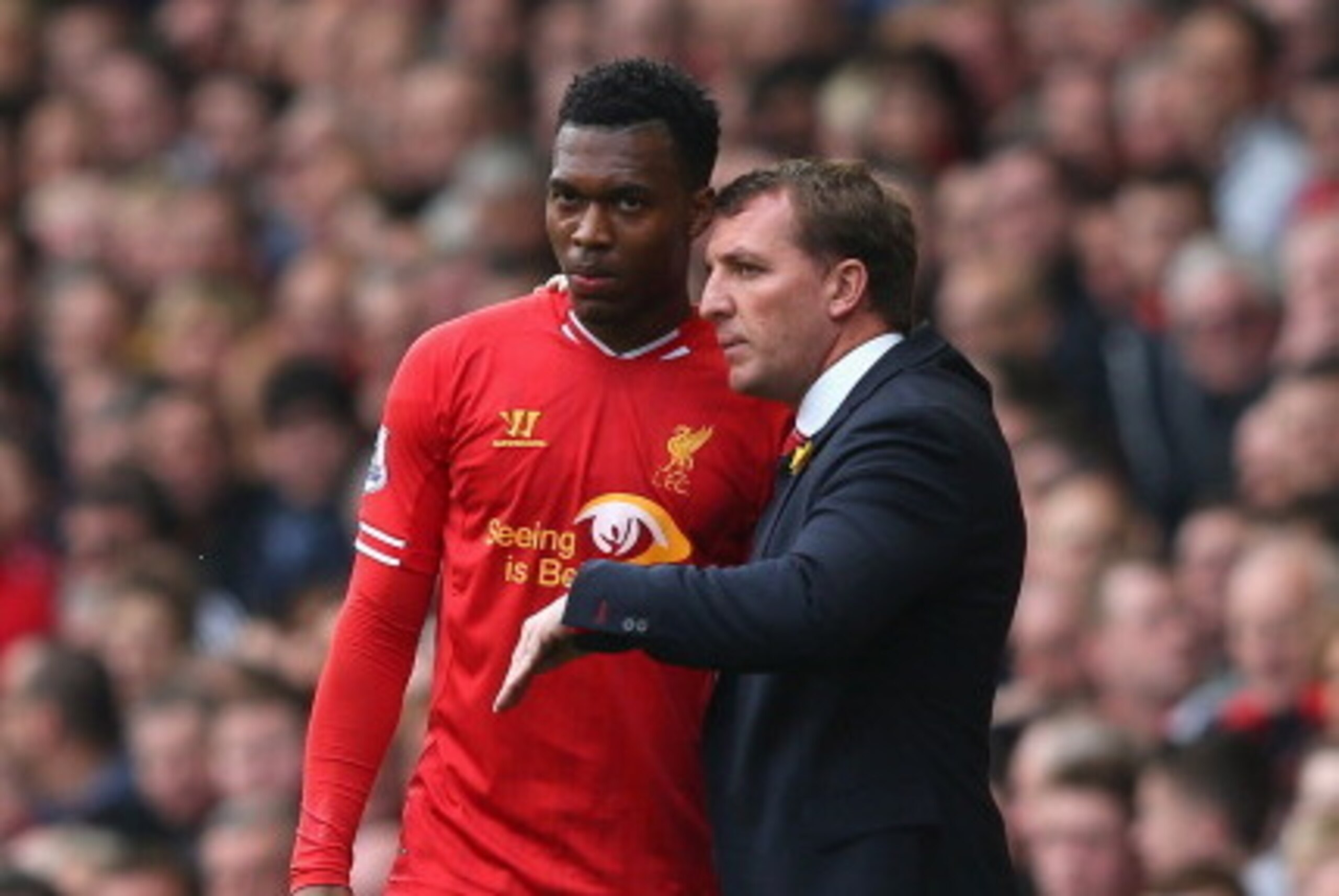 LIVERPOOL, ENGLAND - MARCH 30:  Liverpool Manager Brendan Rodgers speaks to Daniel Sturridge during the Barclays Premier League match between Liverpool and Tottenham Hotspur at Anfield on March 30, 2014 in Liverpool, England.  (Photo by Alex Livesey/Getty