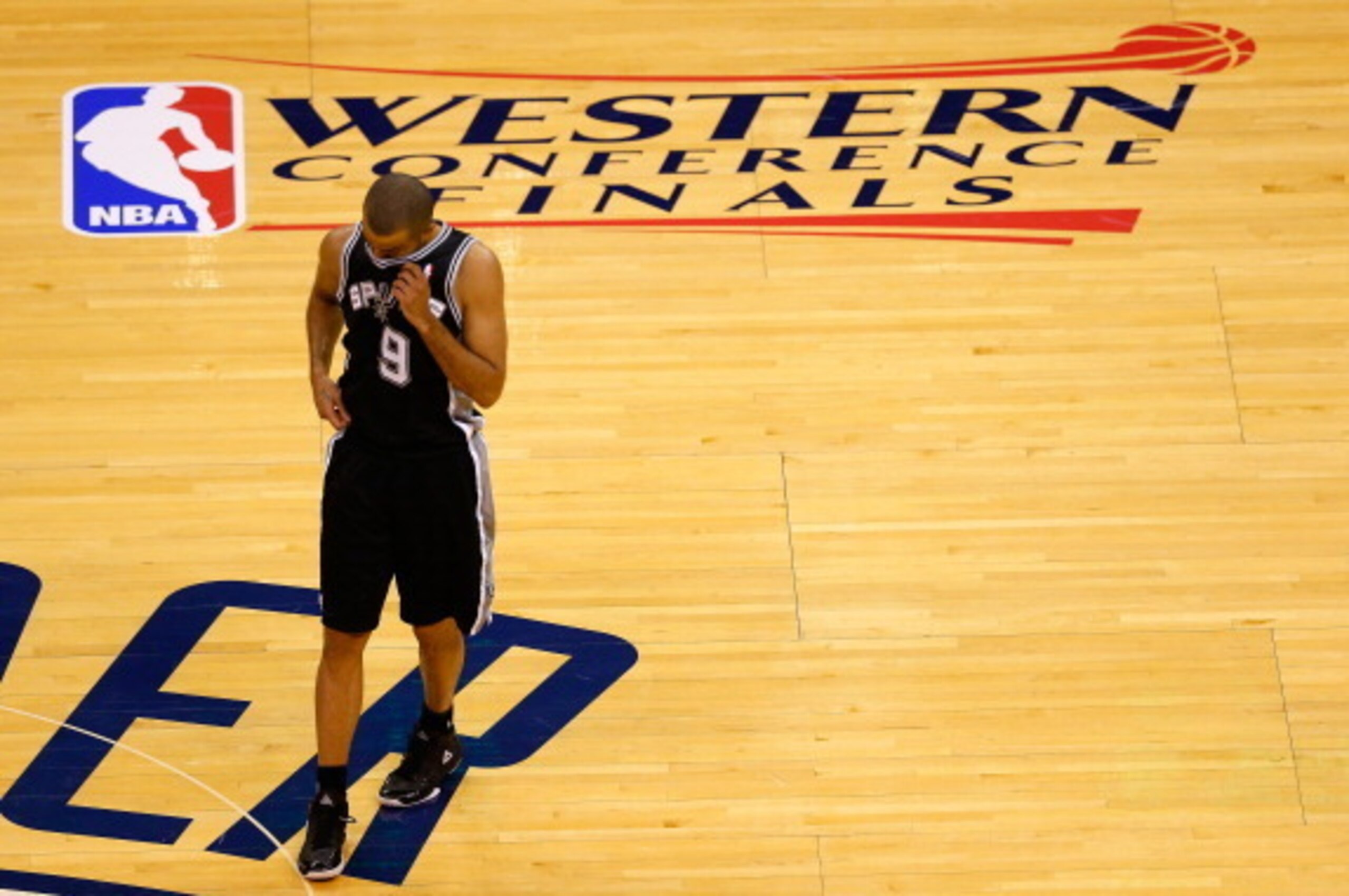 OKLAHOMA CITY, OK - MAY 31:  Tony Parker #9 of the San Antonio Spurs walks across the court in the first half of the game against the Oklahoma City Thunder during Game Six of the Western Conference Finals of the 2014 NBA Playoffs at Chesapeake Energy Aren