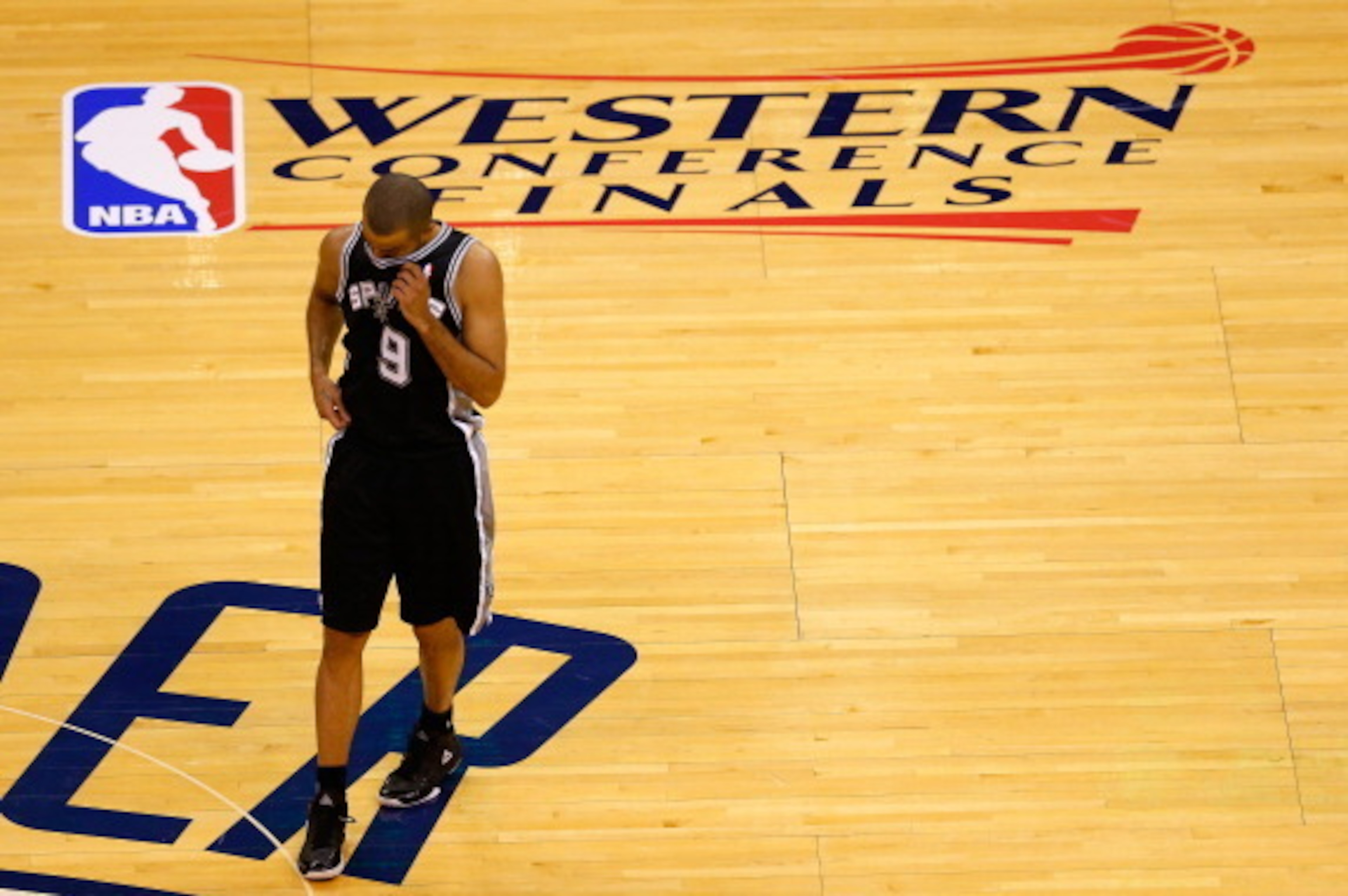 OKLAHOMA CITY, OK - MAY 31:  Tony Parker #9 of the San Antonio Spurs walks across the court in the first half of the game against the Oklahoma City Thunder during Game Six of the Western Conference Finals of the 2014 NBA Playoffs at Chesapeake Energy Aren