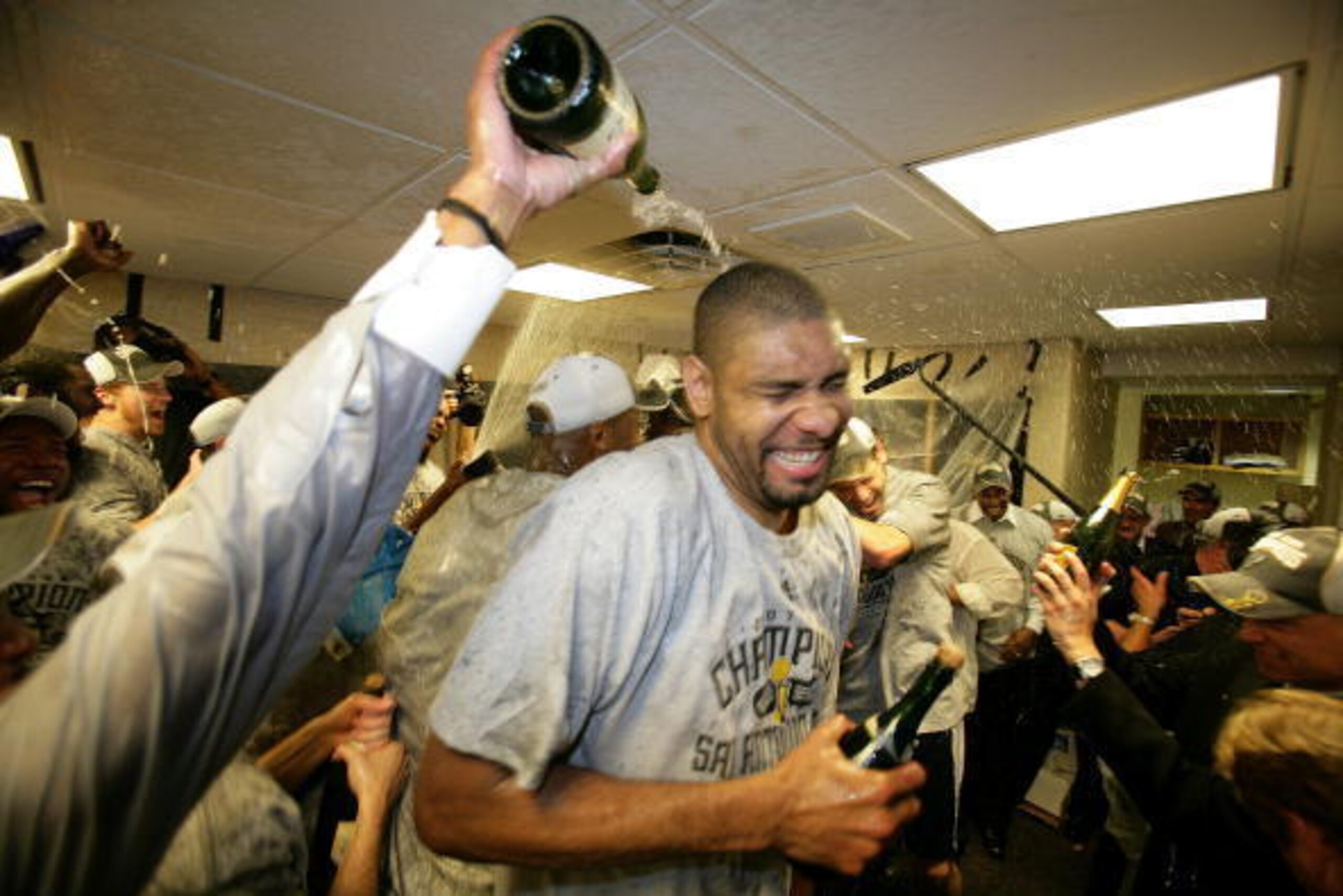 CLEVELAND - JUNE 14:  Tim Duncan #21 of the San Antonio Spurs celebrates in the locker after their 83-82 win against the Cleveland Cavaliers in Game Four of the NBA Finals at the Quicken Loans Arena on June 14, 2007 in Cleveland, Ohio. NOTE TO USER: User 
