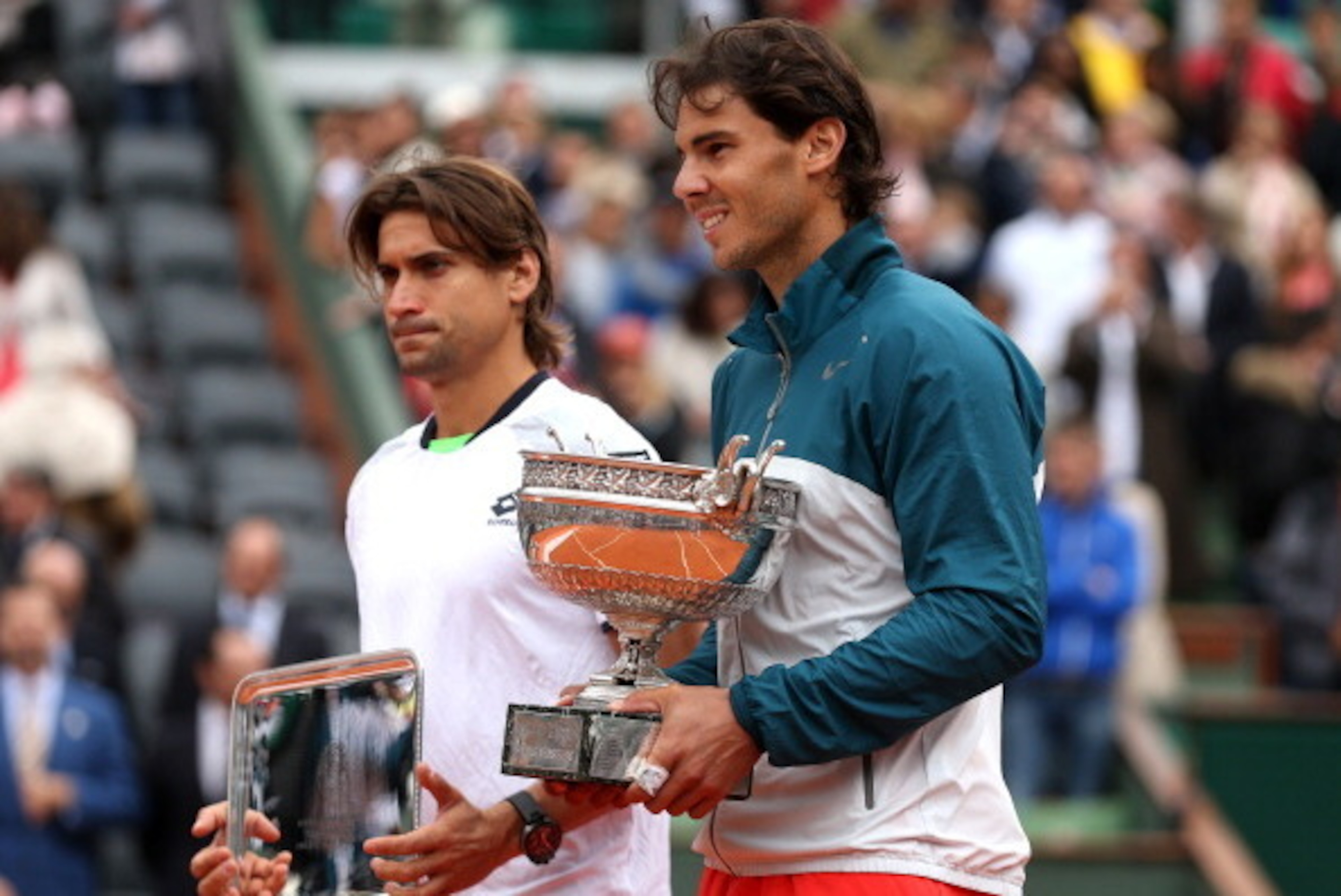 PARIS, FRANCE - JUNE 09:  Runner up David Ferrer of Spain and winner Rafael Nadal of Spain pose after the mens' singles final during day fifteen of the French Open at Roland Garros on June 9, 2013 in Paris, France.  (Photo by Matthew Stockman/Getty Images