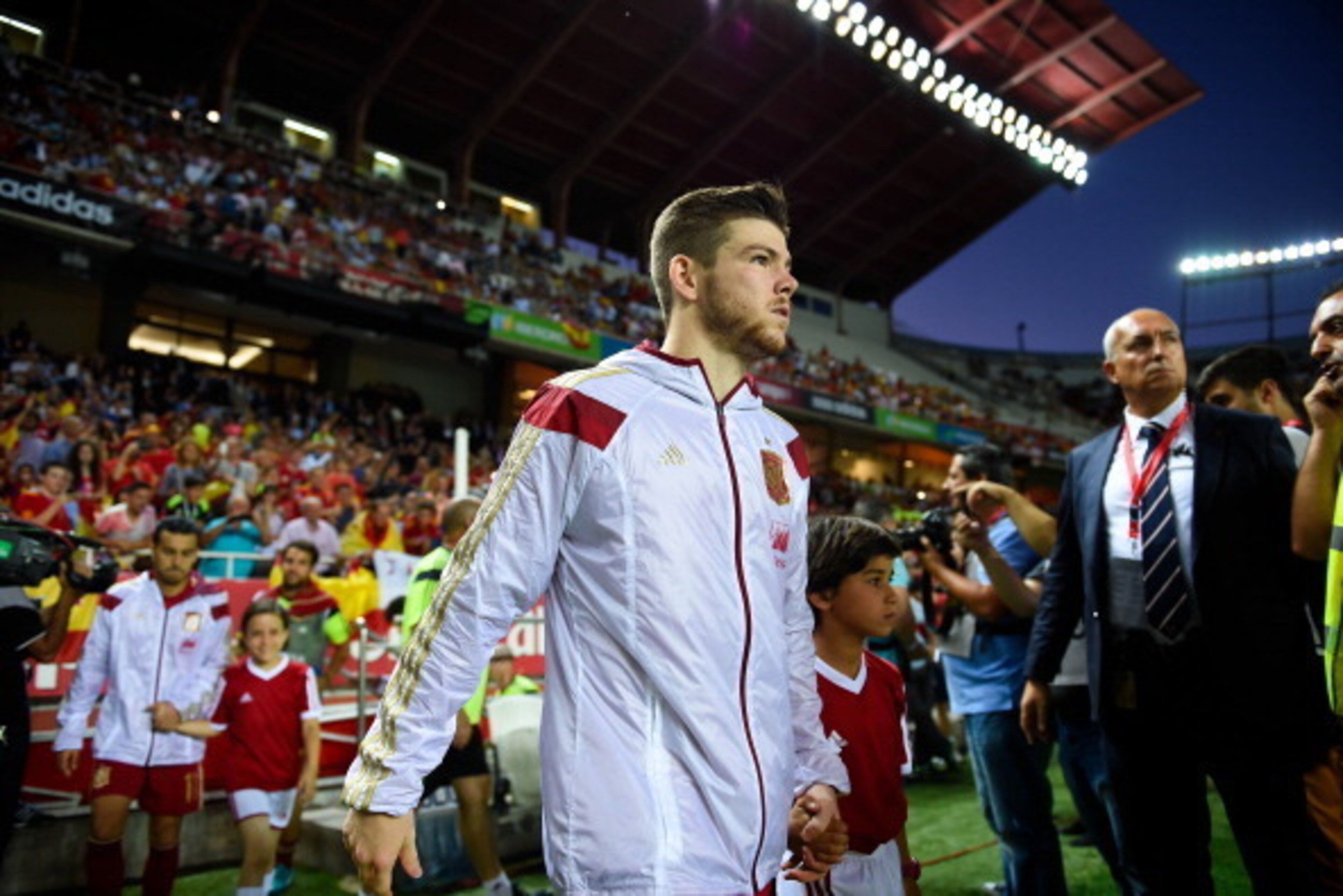 SEVILLE, SPAIN - MAY 30:  Alberto Moreno of Spain walks onto the pitch prior to an international friendly match between Spain and Bolivia at Estadio Ramon Sanchez Pizjuan on May 30, 2014 in Seville, Spain.  (Photo by David Ramos/Getty Images)