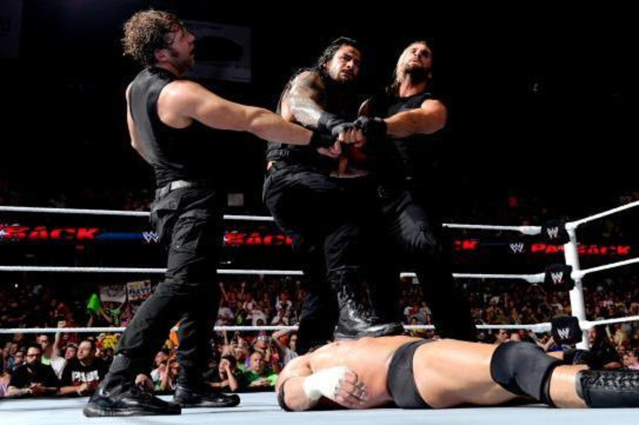 How Payback closed, The Shield towering over Triple H.