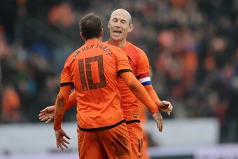 GENK, BELGIUM - NOVEMBER 16:  Arjen Robben of Netherlands celebrates the second goal with teammate Rafael van der Vaart during the International Friendly match between the Netherlands and Japan on November 16, 2013 in Genk, Belgium.  (Photo by Dennis Grom
