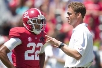 Apr 19, 2014; Tuscaloosa, AL, USA;  Alabama Crimson Tide offensive coordinator/quarterbacks coach Lane Kiffin talks to wide receiver Christion Jones (22) prior to the A-Day game at Bryant-Denny Stadium. Mandatory Credit: Marvin Gentry-USA TODAY Sports