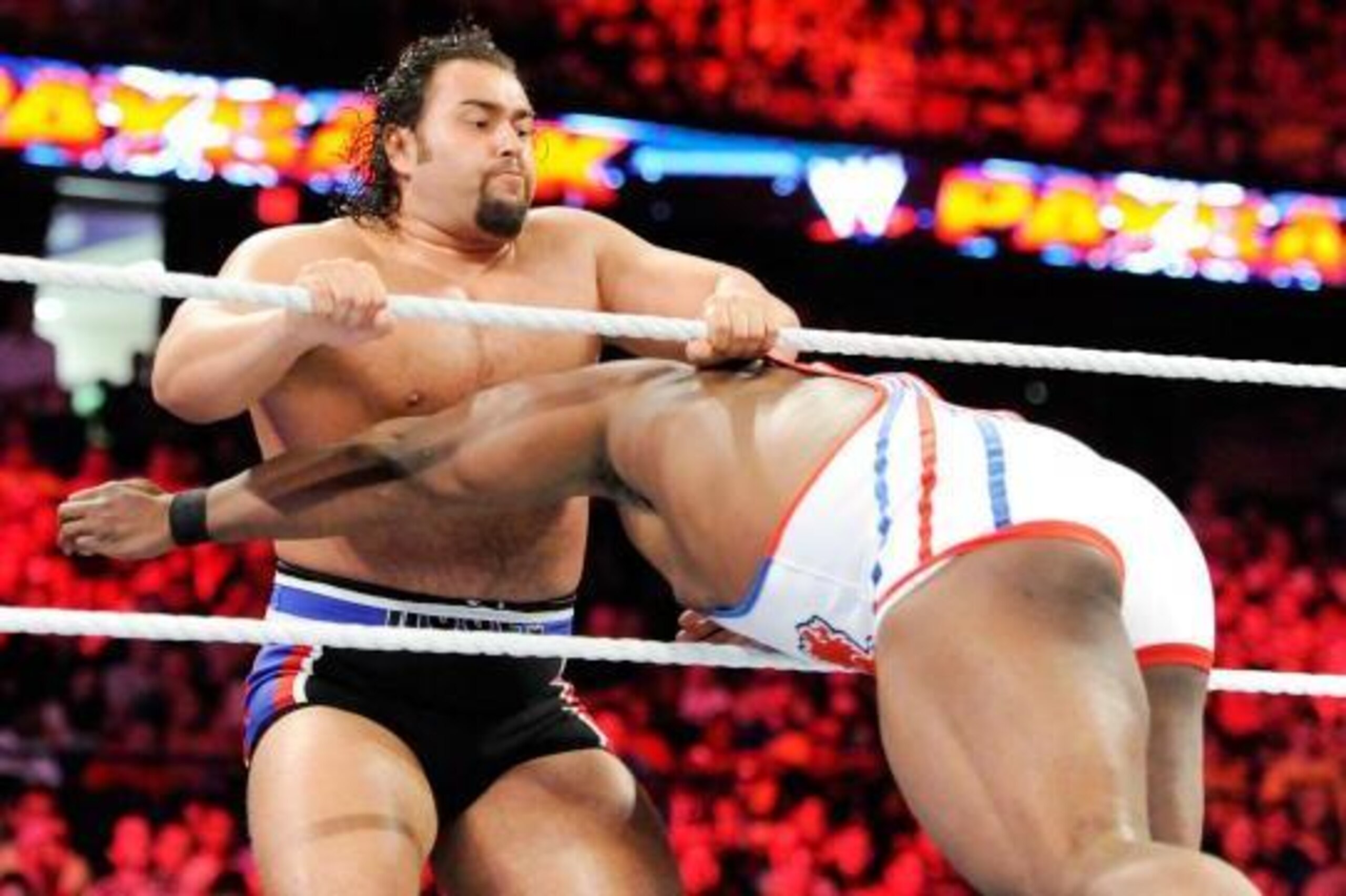 Big E hits a spear on Rusev. Big E hits a spear on Rusev.