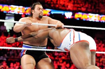 Big E spears Rusev.