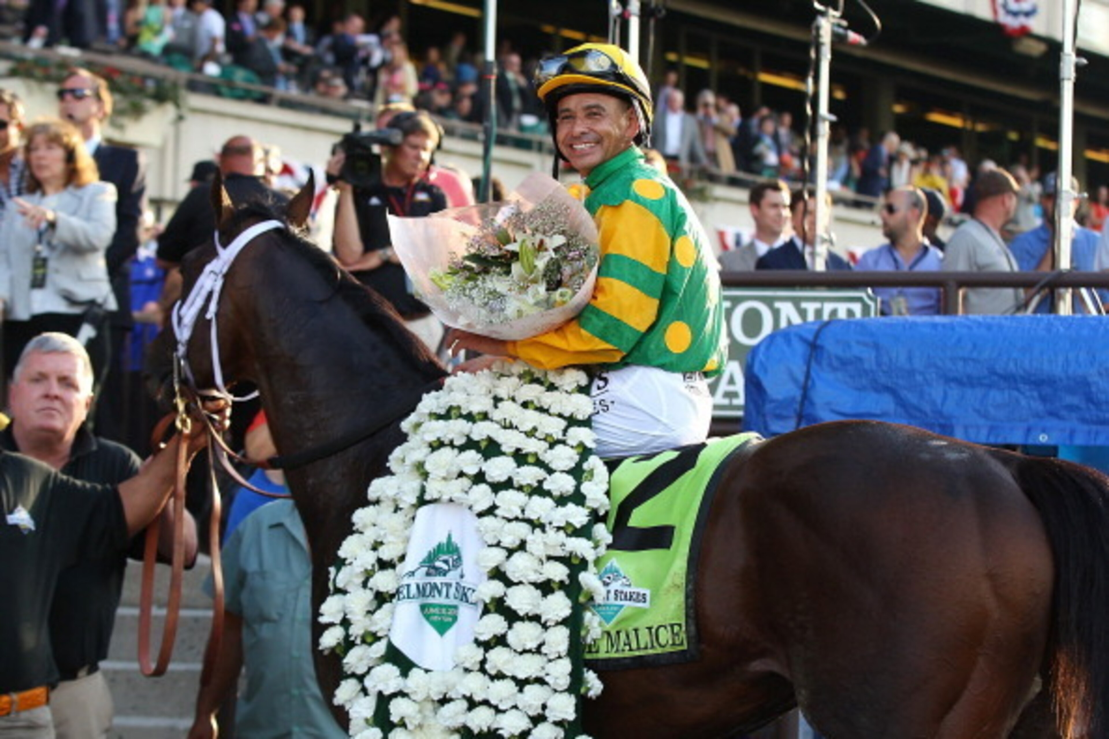 ELMONT, NY - JUNE 08:  Jockey Mike Smith sits aboard Palace Malice in the winners circle after winning the 145th running of the Belmont Stakes at Belmont Park on June 8, 2013 in Elmont, New York.  (Photo by Mike Stobe/Getty Images)