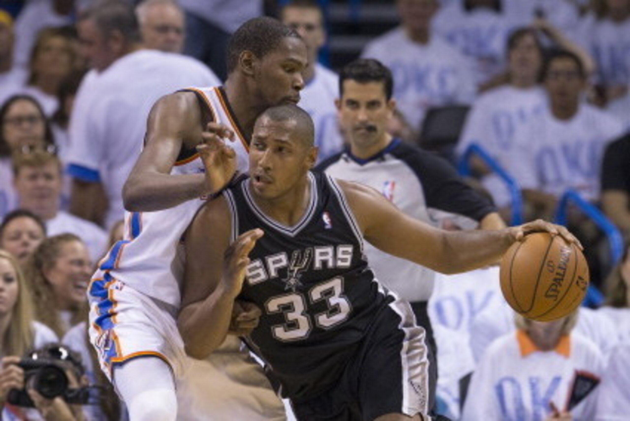 OKLAHOMA CITY, OK - May 31:  Boris Diaw #33 of the San Antonio Spurs handles the ball against Kevin Durant #35 of the Oklahoma City Thunder in Game 6 of the Western Conference Finals during the 2014 NBA Playoffs at the Chesapeake Arena on May 31, 2014 in 