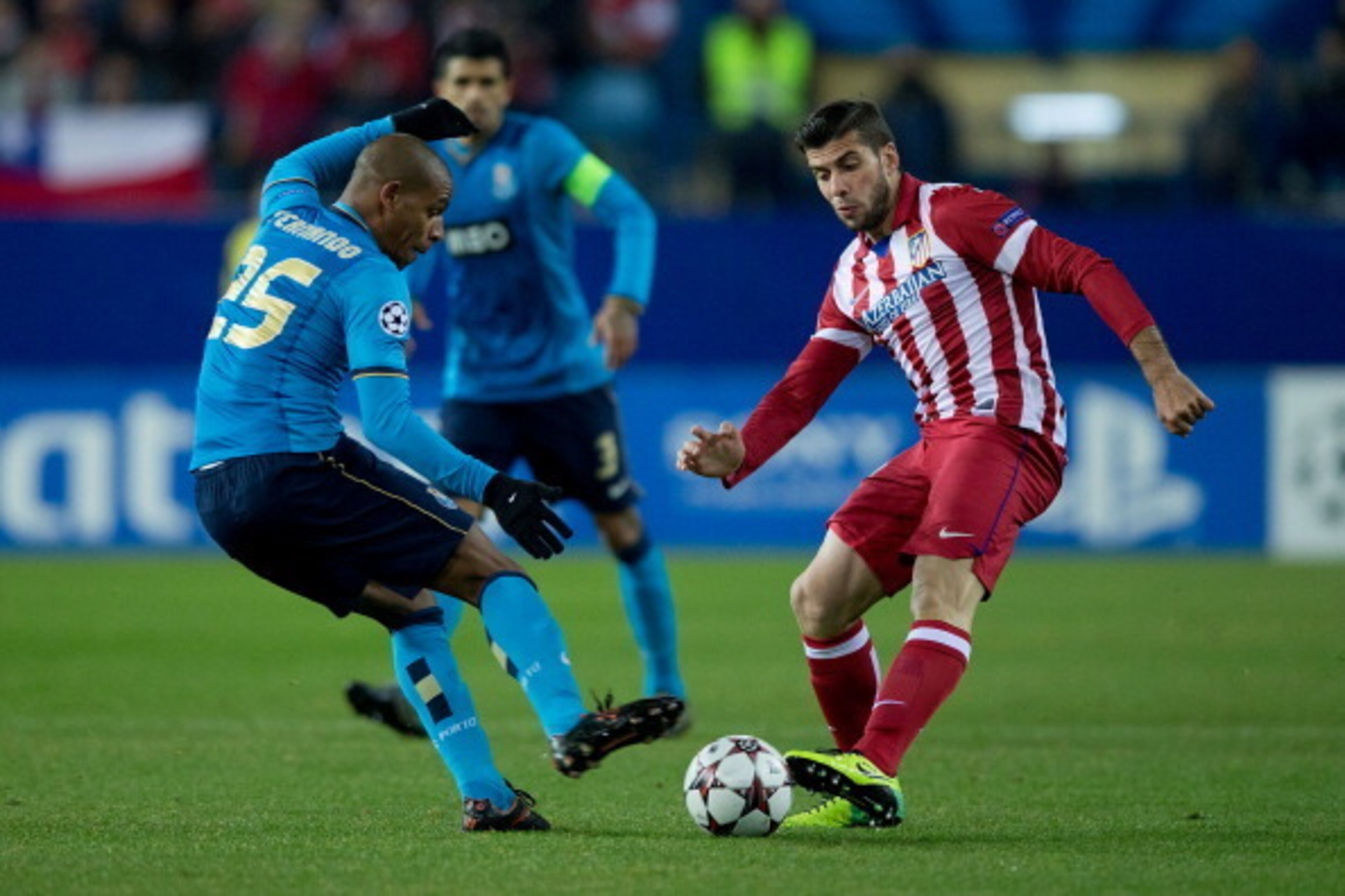 MADRID, SPAIN - DECEMBER 11: Emiliano Insua (R) of Atletico de Madrid competes for the ball with Fernando Reges (L) of FC Porto during the UEFA Champions League Group G match at Vicente Calderon Stadium on December 11, 2013 in Madrid, Spain. (Photo by Go MADRID, SPAIN - DECEMBER 11: Emiliano Insua (R) of Atletico de Madrid competes for the ball with Fernando Reges (L) of FC Porto during the UEFA Champions League Group G match at Vicente Calderon Stadium on December 11, 2013 in Madrid, Spain. (Photo by Go