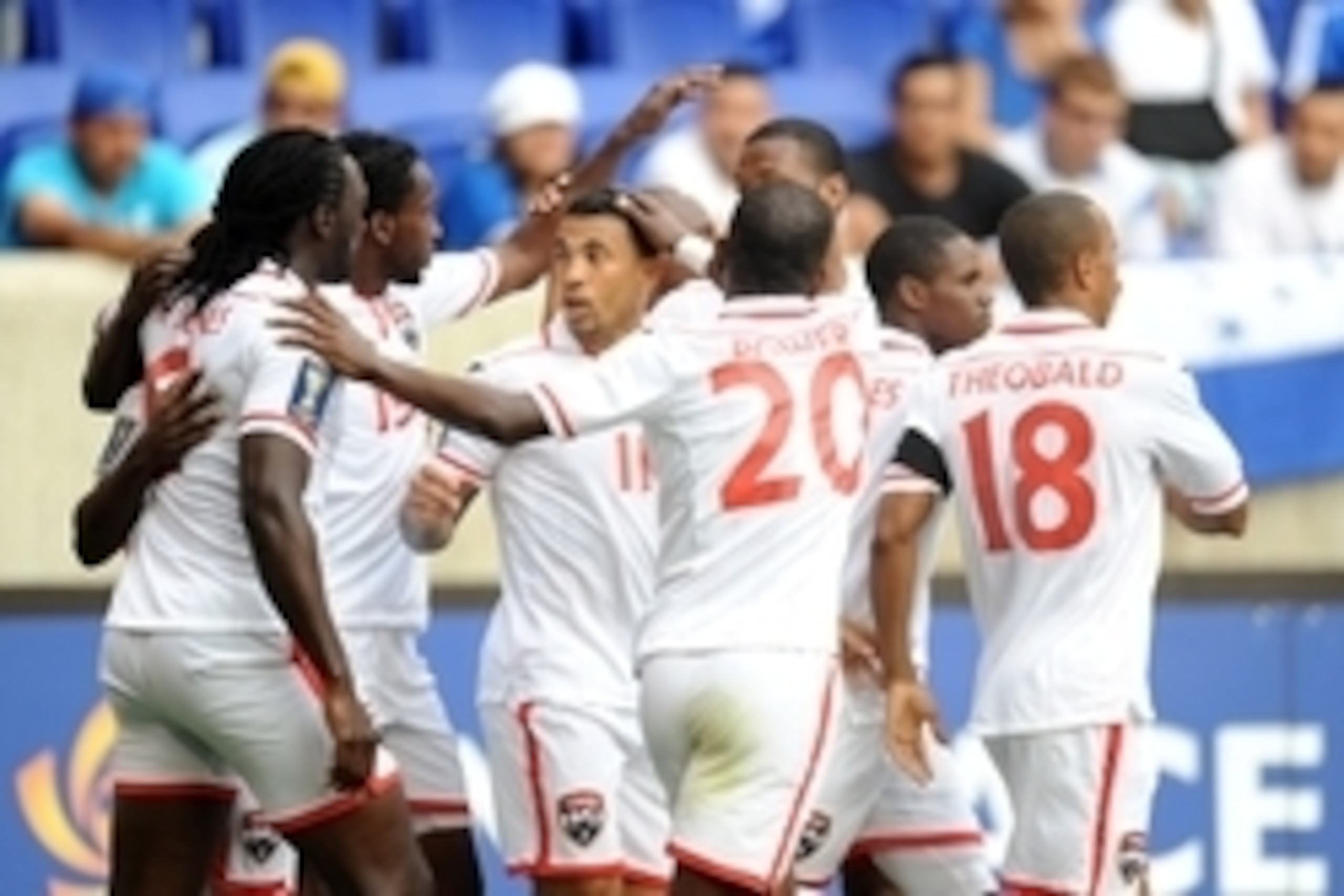 Jul 8, 2013; Harrison, NJ, USA; Trinidad and Tobago forward Trinidad and Tobago midfielder Keon Daniel (19) celebrates his goal with teammates during the first half at Red Bull Arena. Mandatory Credit: Joe Camporeale-USA TODAY Sports