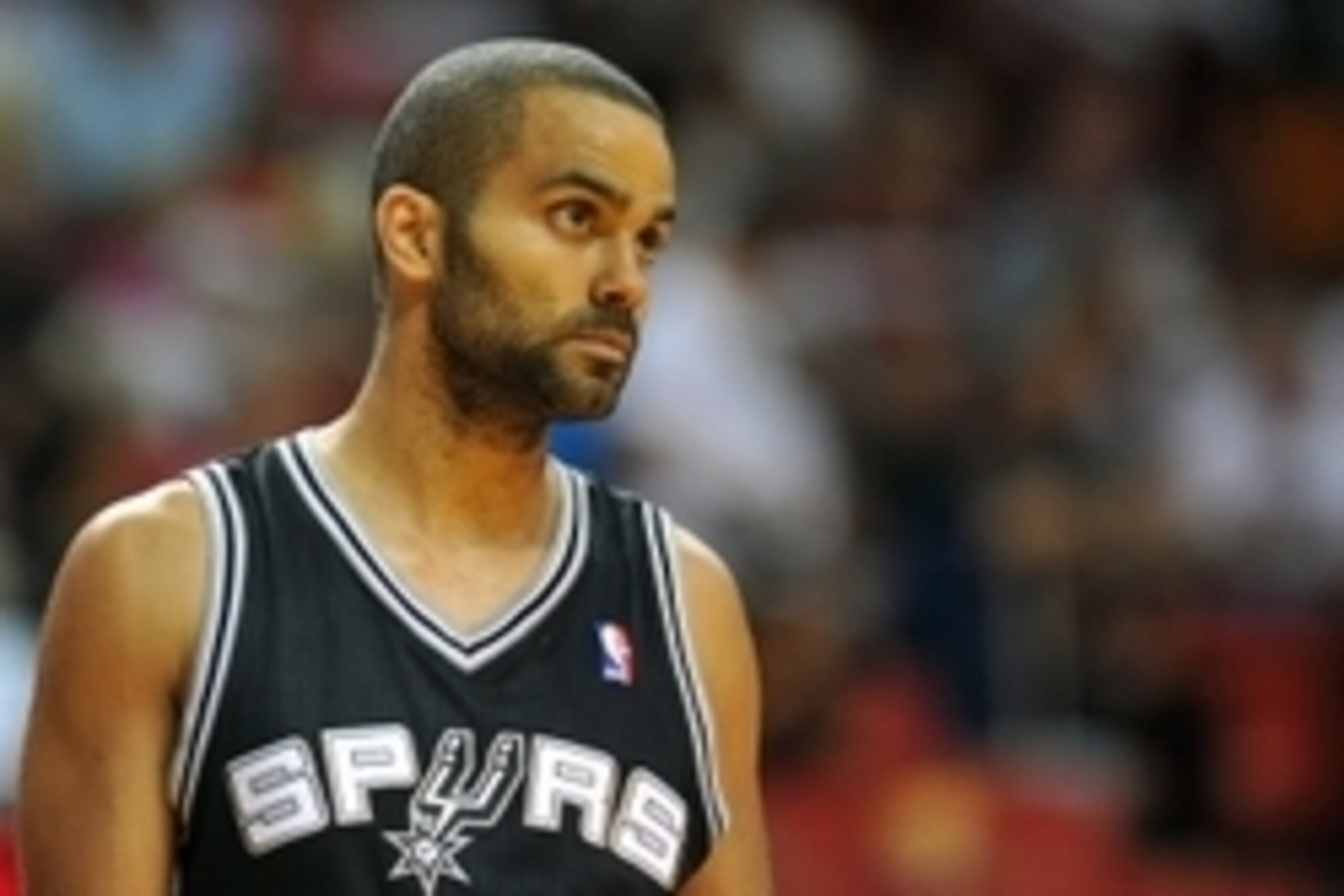 Oct 19, 2013; Miami, FL, USA; San Antonio Spurs point guard Tony Parker (9) looks on during the third quarter against the Miami Heat at American Airlines Arena. Mandatory Credit: Steve Mitchell-USA TODAY Sports