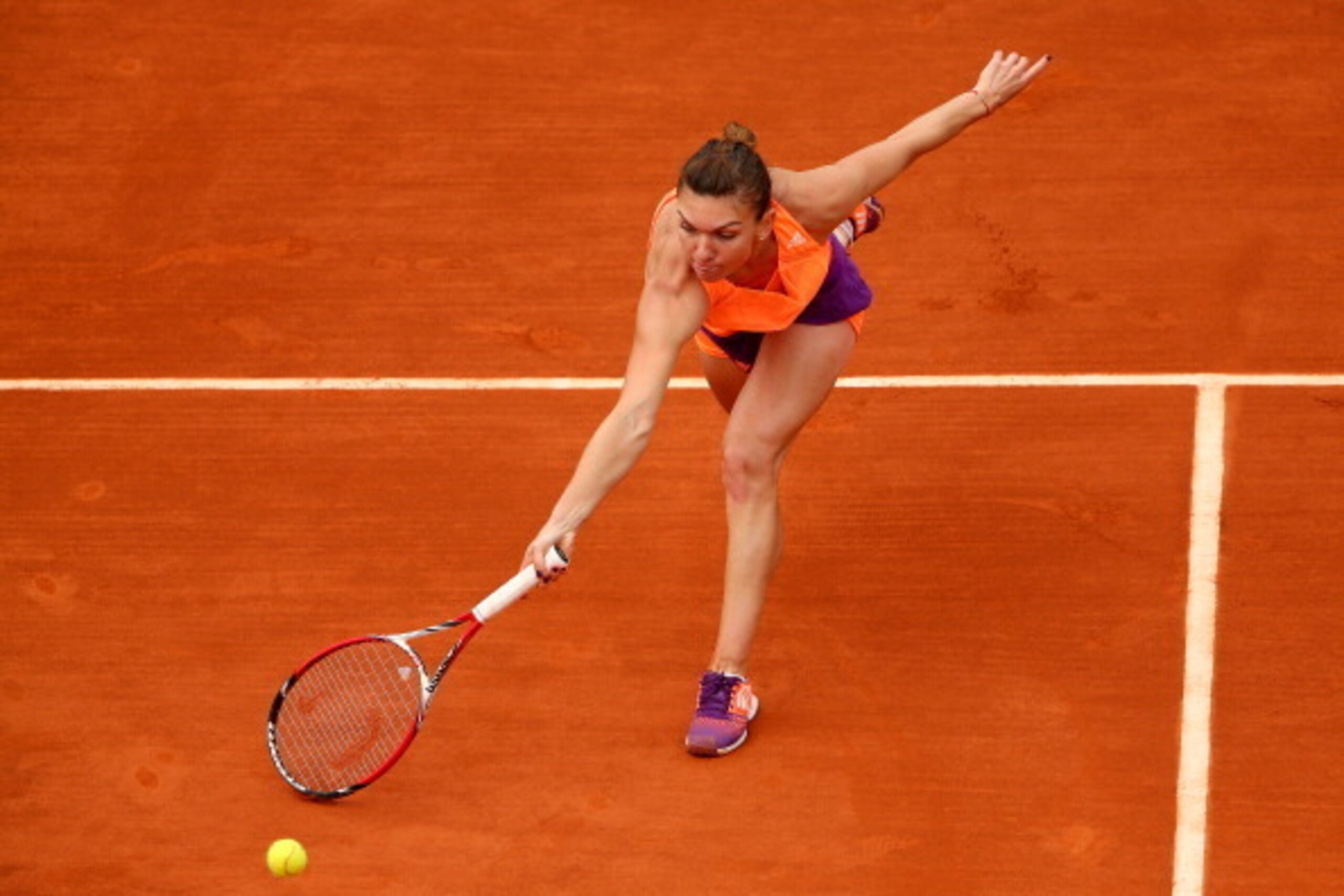 PARIS, FRANCE - JUNE 02: Simona Halep of Romania returns a shot during her women's singles match against Sloane Stephens of the United States on day nine of the French Open at Roland Garros on June 2, 2014 in Paris, France. (Photo by Clive Brunskill/Ge PARIS, FRANCE - JUNE 02: Simona Halep of Romania returns a shot during her women's singles match against Sloane Stephens of the United States on day nine of the French Open at Roland Garros on June 2, 2014 in Paris, France. (Photo by Clive Brunskill/Ge