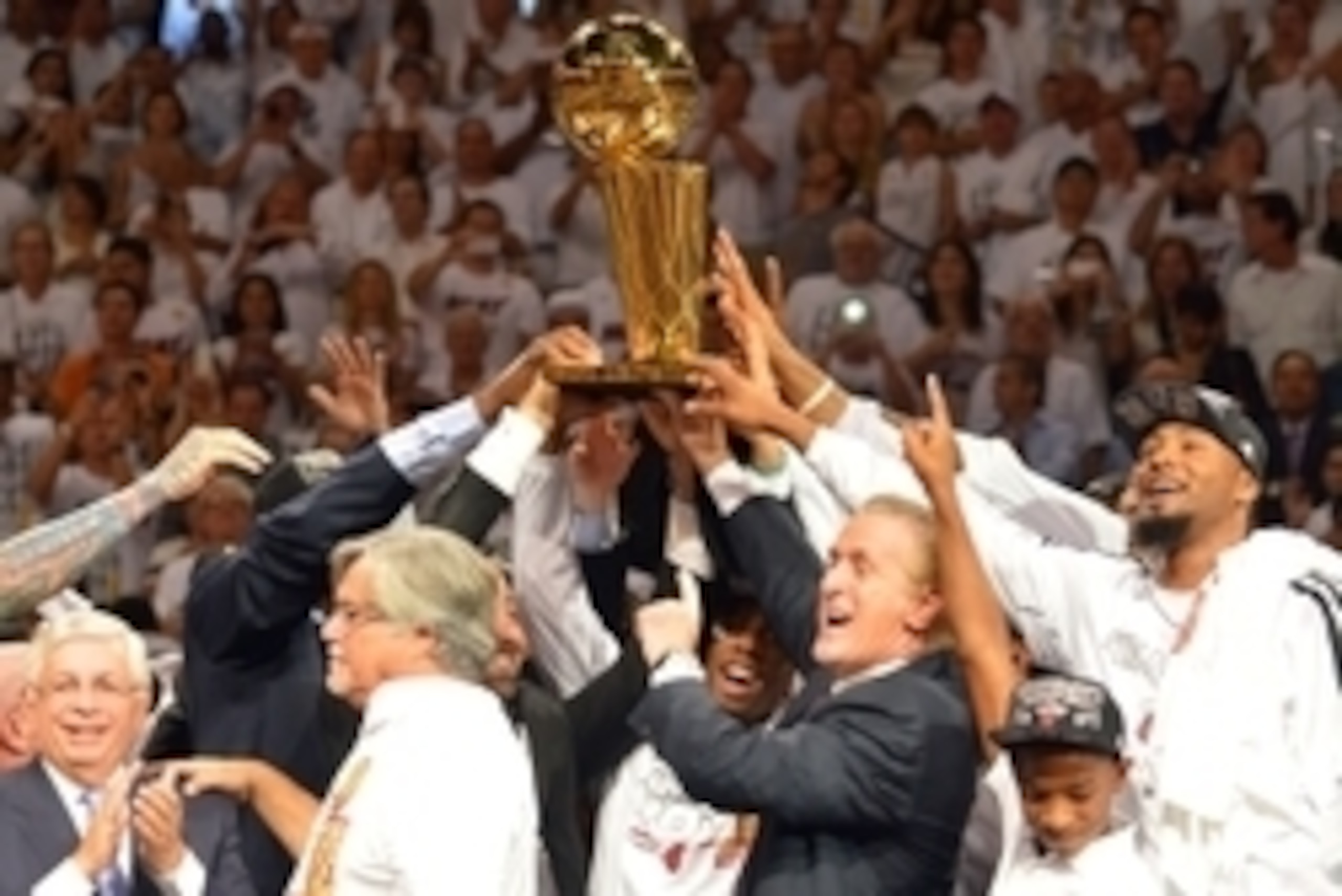 Jun 20, 2013; Miami, FL, USA; Miami Heat president Pat Riley holds the Larry O'Brien Championship trophy after defeating the San Antonio Spurs in game seven in the 2013 NBA Finals at American Airlines Arena. Miami Heat won 95-88 to win the NBA Championshi