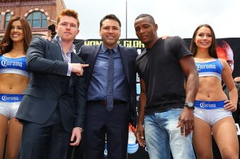 LOS ANGELES, CA - MAY 06:  Boxers Canelo Alvarez (2nd from left) and Erislandy Lara (2nd from right) and Oscar De La Hoya (C), president of Golden Boy Promotions, pose onstage during the press conference for Canelo Alvarez v Erislandy Lara on May 6, 2014 