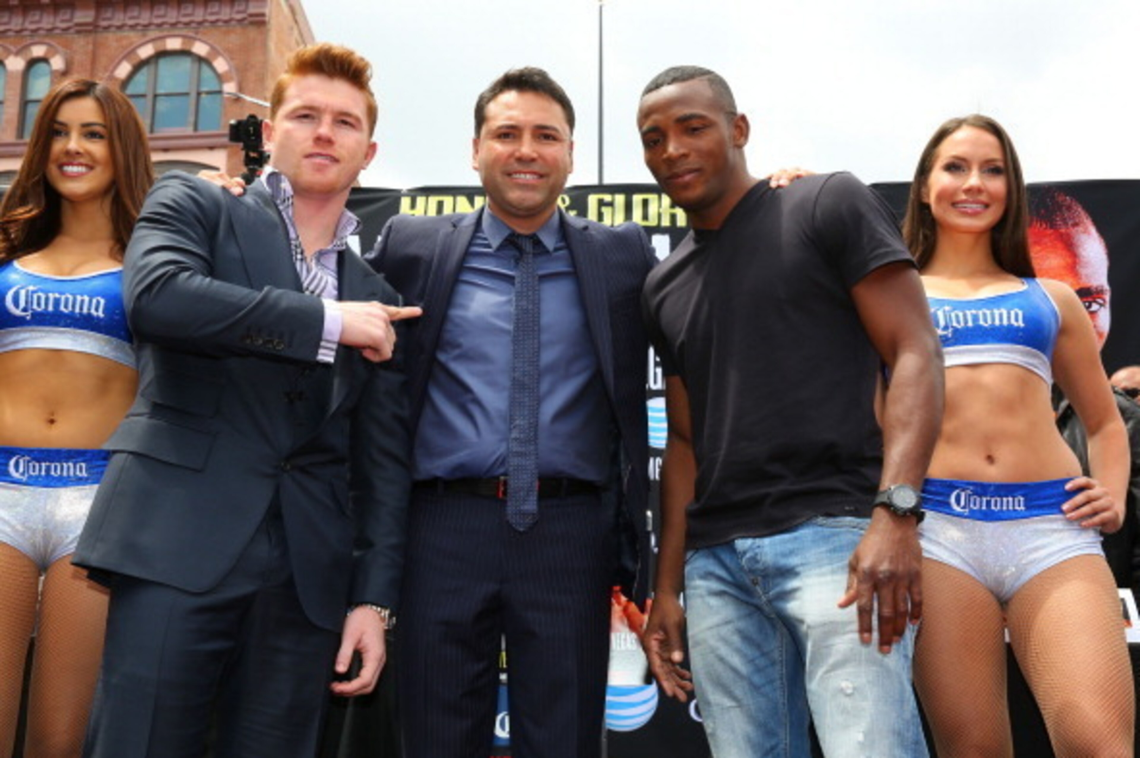 LOS ANGELES, CA - MAY 06:  Boxers Canelo Alvarez (2nd from left) and Erislandy Lara (2nd from right) and Oscar De La Hoya (C), president of Golden Boy Promotions, pose onstage during the press conference for Canelo Alvarez v Erislandy Lara on May 6, 2014 